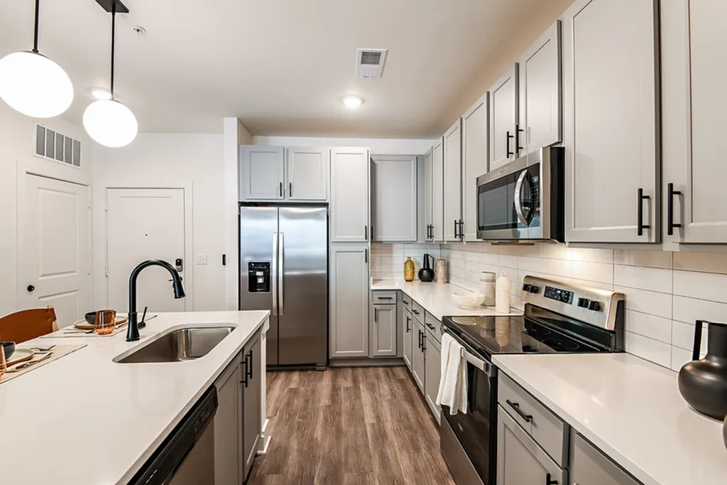 Sleek modern kitchen featuring stainless steel appliances, elegant cabinetry, and a stylish open layout.