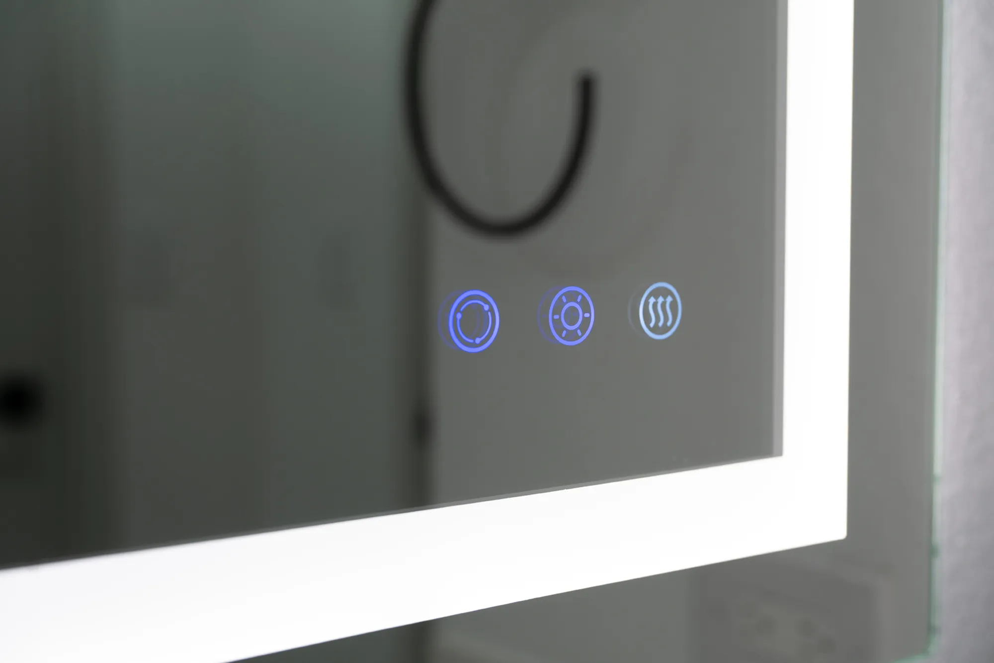 Modern bathroom mirror with touch-sensitive controls and illuminated LED lighting for a sleek, futuristic look.