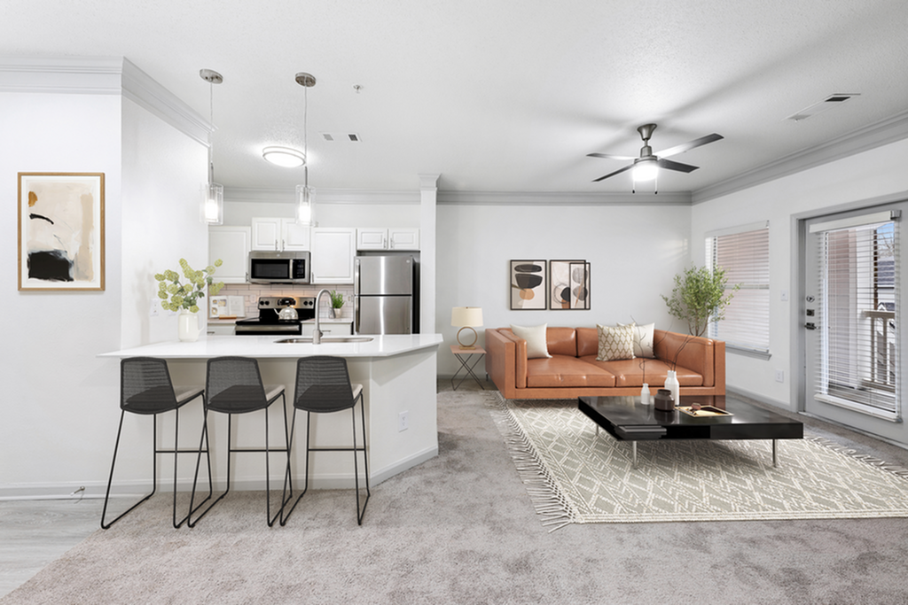 Chic open-concept living area with modern kitchen and cozy seating, perfect for stylish urban living.