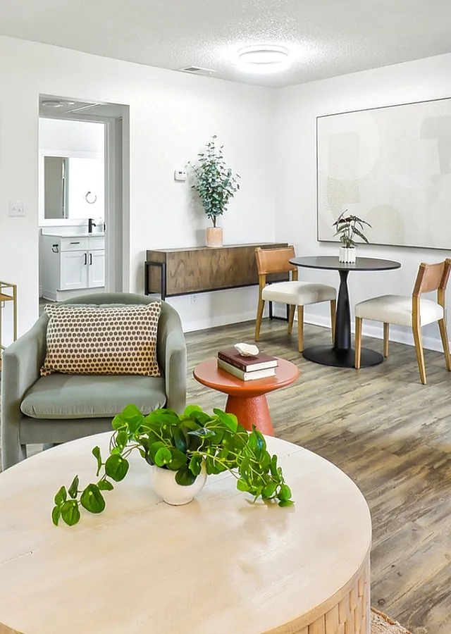 Renovated living room with furniture and wood-style flooring
