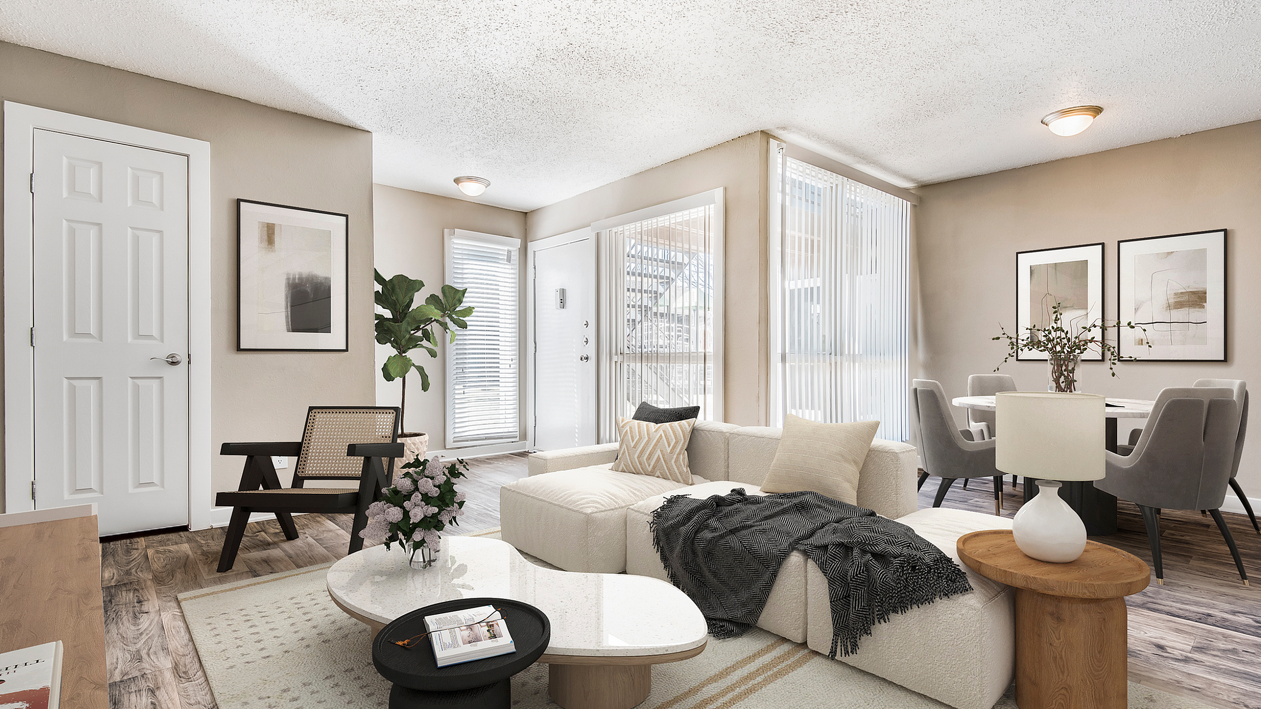 Bright and stylish living room with modern furniture, cozy sectional sofa, and sleek dining area.