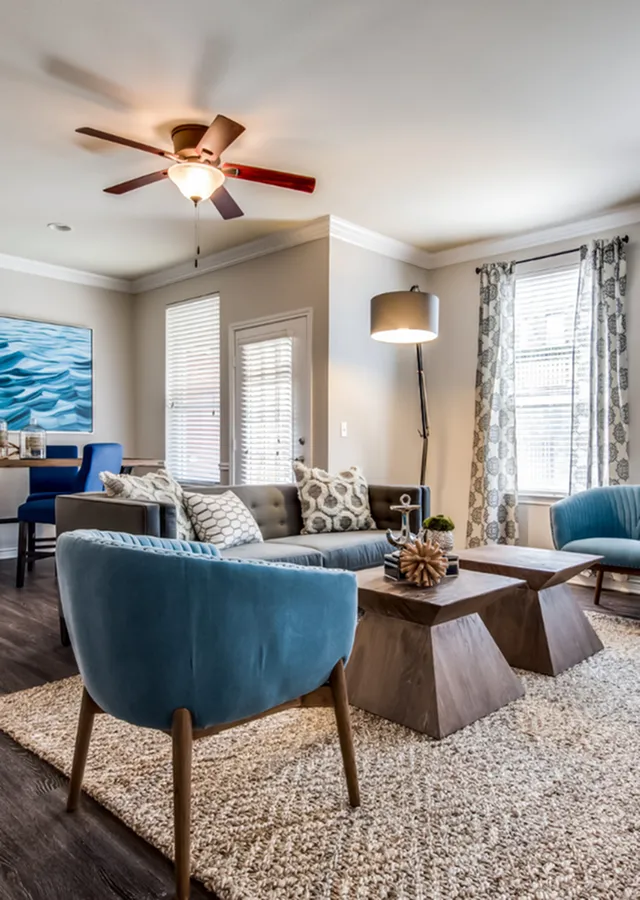 Charming living room with plush seating, elegant decor, and abundant natural light.