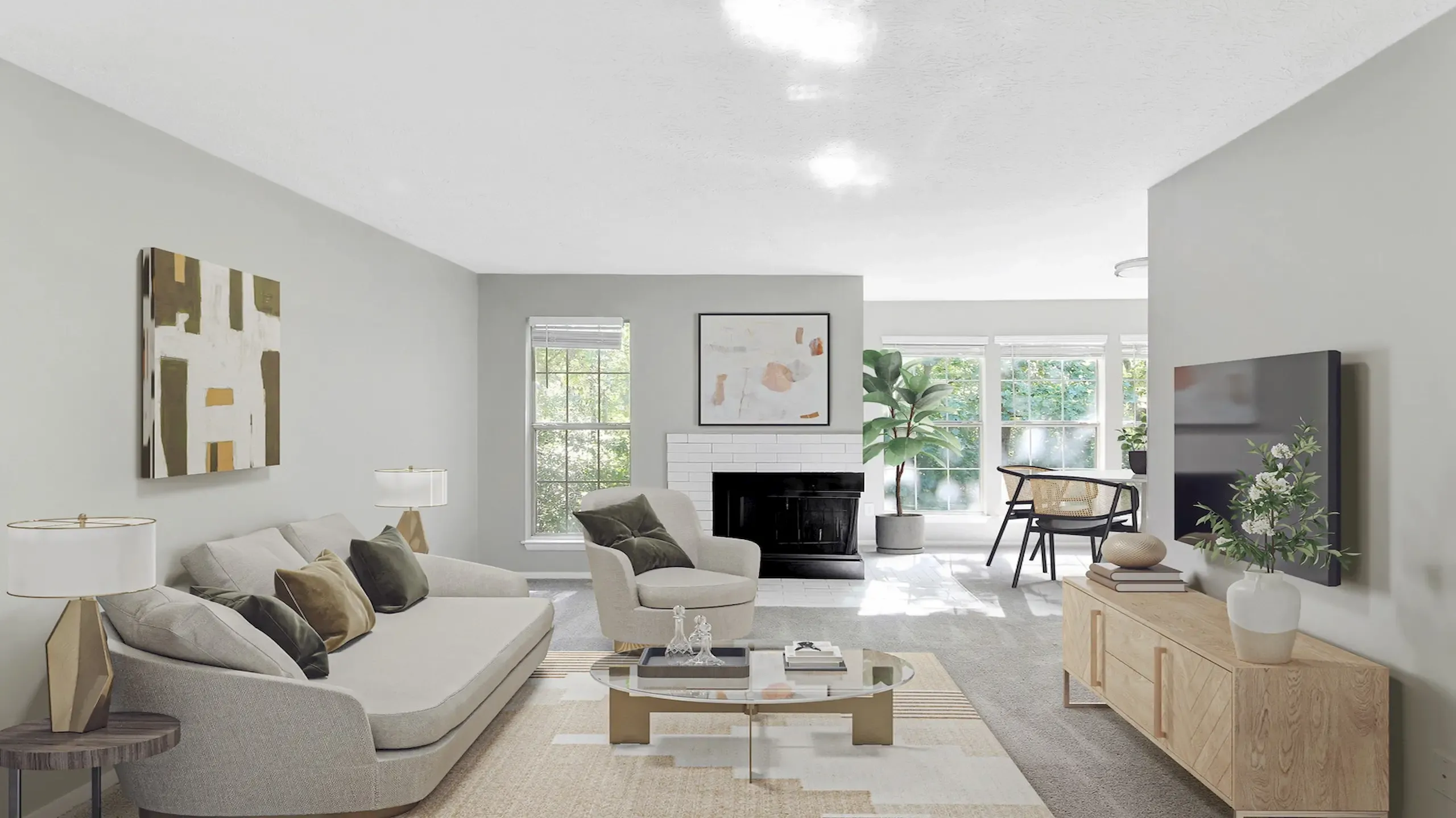Open-concept apartment living room with modern furnishings, decorative fireplace, large windows, wall-mounted TV, and abundant natural light.