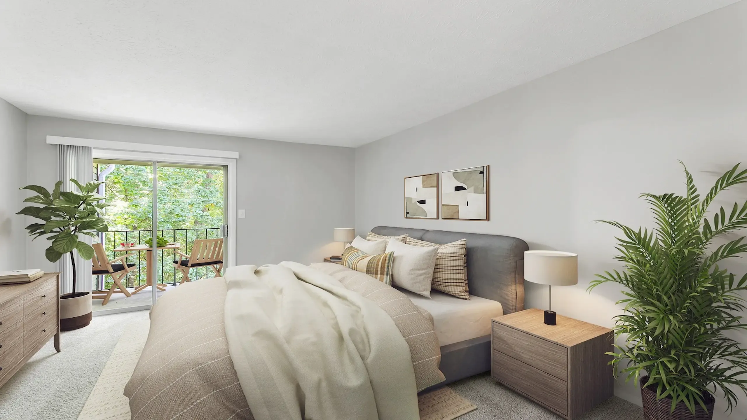 Modern apartment bedroom with plush carpeting, stylish furnishings, sliding glass door to private balcony, and abundant natural light.