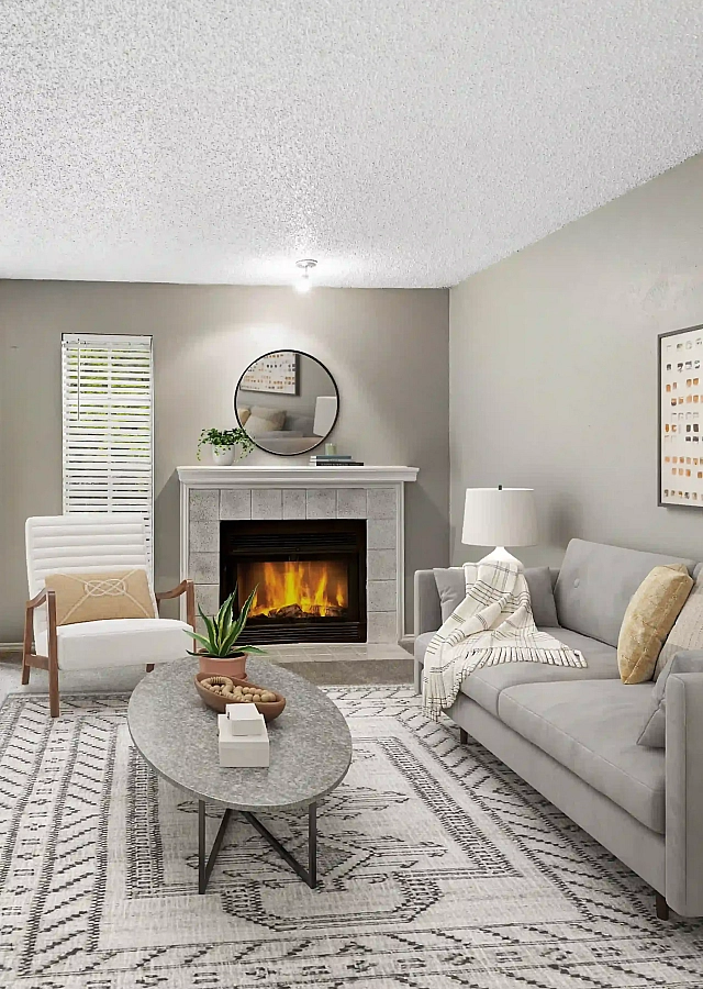 Inviting living room with cozy fireplace, sleek modern furniture, and large windows offering natural light.