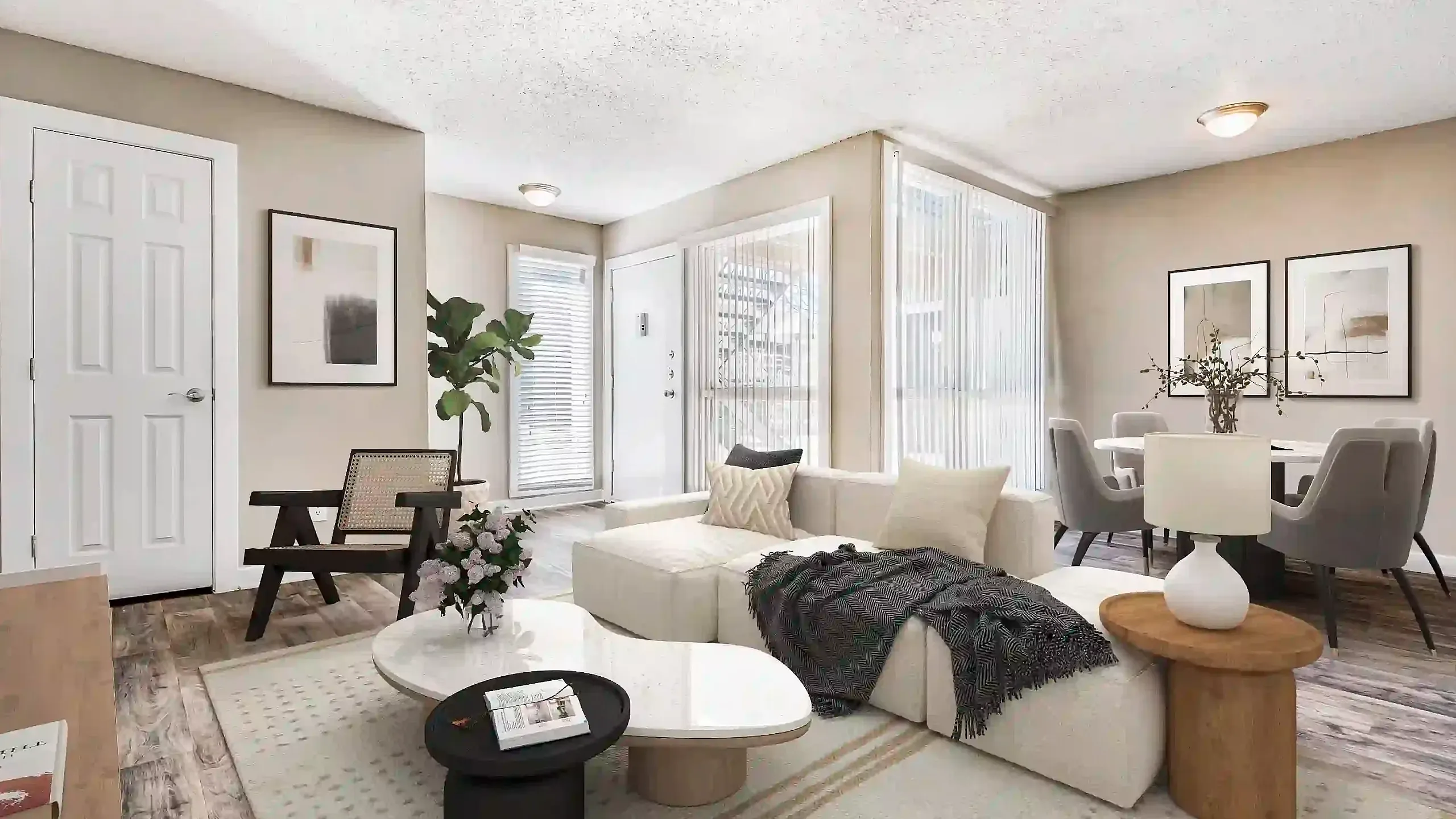Bright and stylish living room with modern furniture, cozy sectional sofa, and sleek dining area.