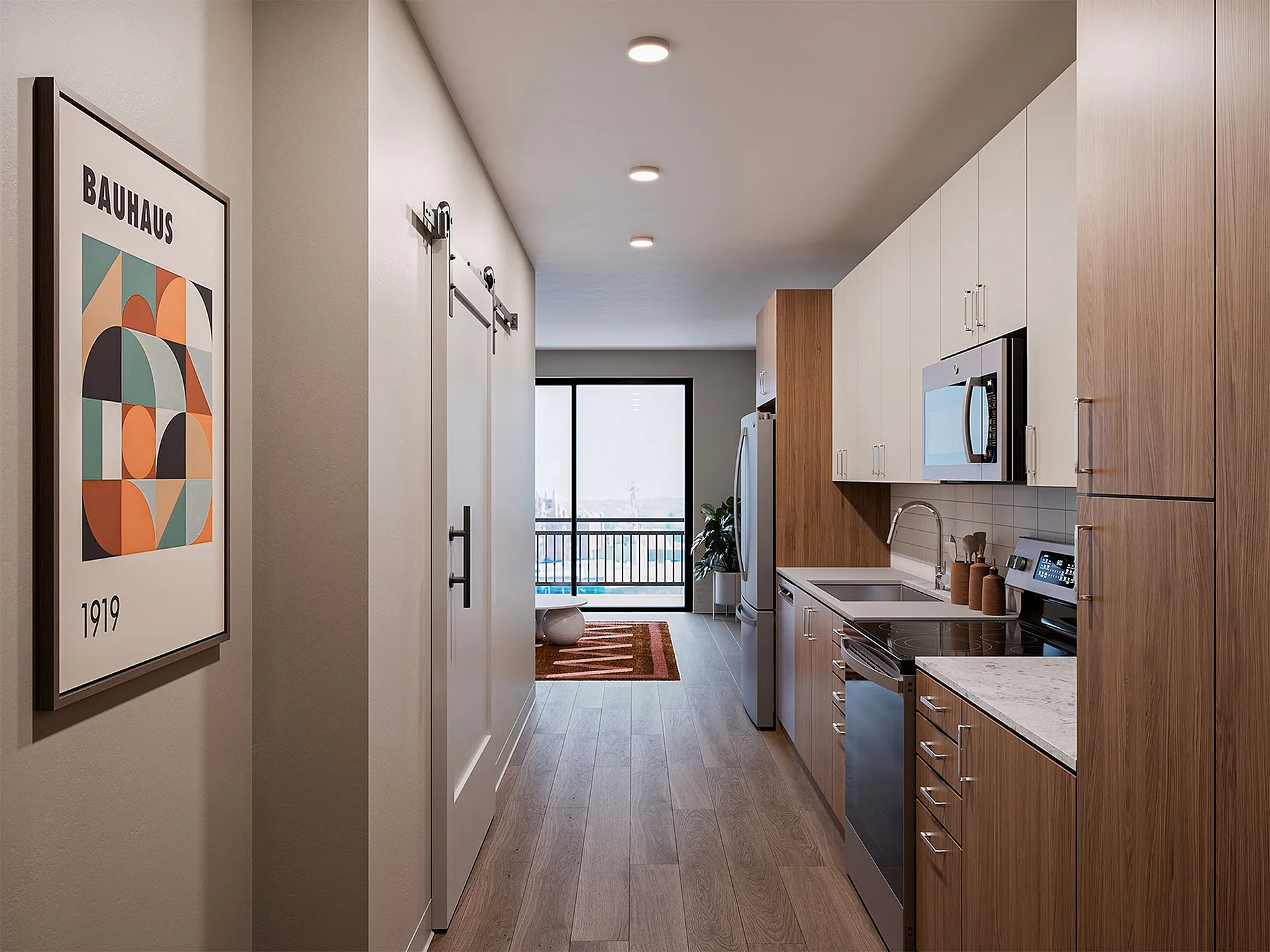 Modern apartment kitchen with sleek wood cabinetry, stainless steel appliances, and a stylish Bauhaus artwork.