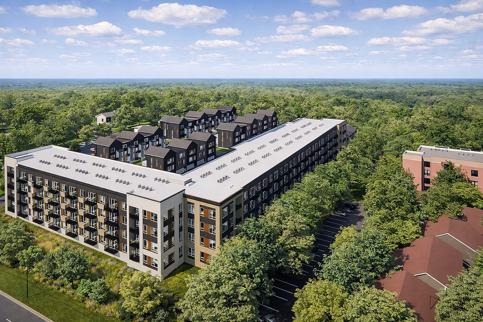 Modern apartment complex surrounded by lush green landscape, offering a tranquil living environment with stylish architecture and ample windows for natural light.