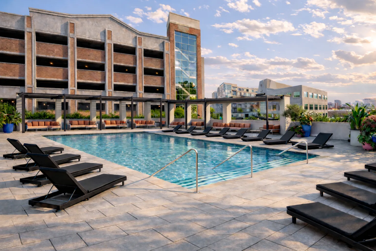 Luxurious outdoor pool area with sleek lounge chairs, modern pergolas, and lush greenery, set against a stylish urban building backdrop.