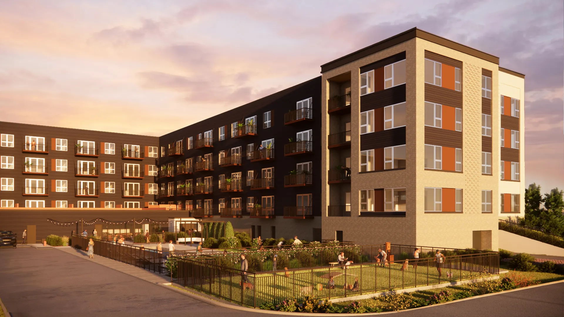 Modern apartment complex with stylish balconies and a vibrant communal garden area, set against a stunning sunset backdrop.