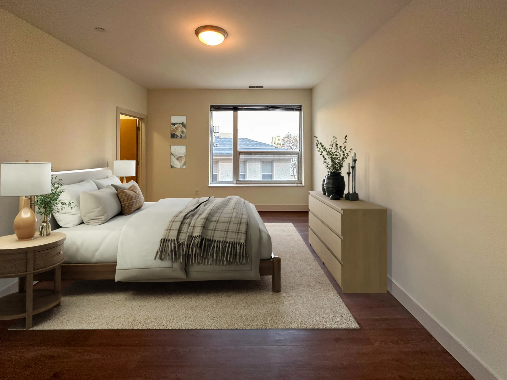 Inviting bedroom with elegant decor, large window, and cozy natural lighting.