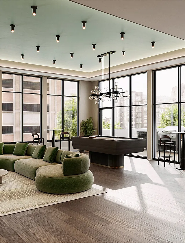 Luxurious open-concept living room with modern green sectional sofa, elegant lighting, and expansive floor-to-ceiling windows offering spectacular city views.