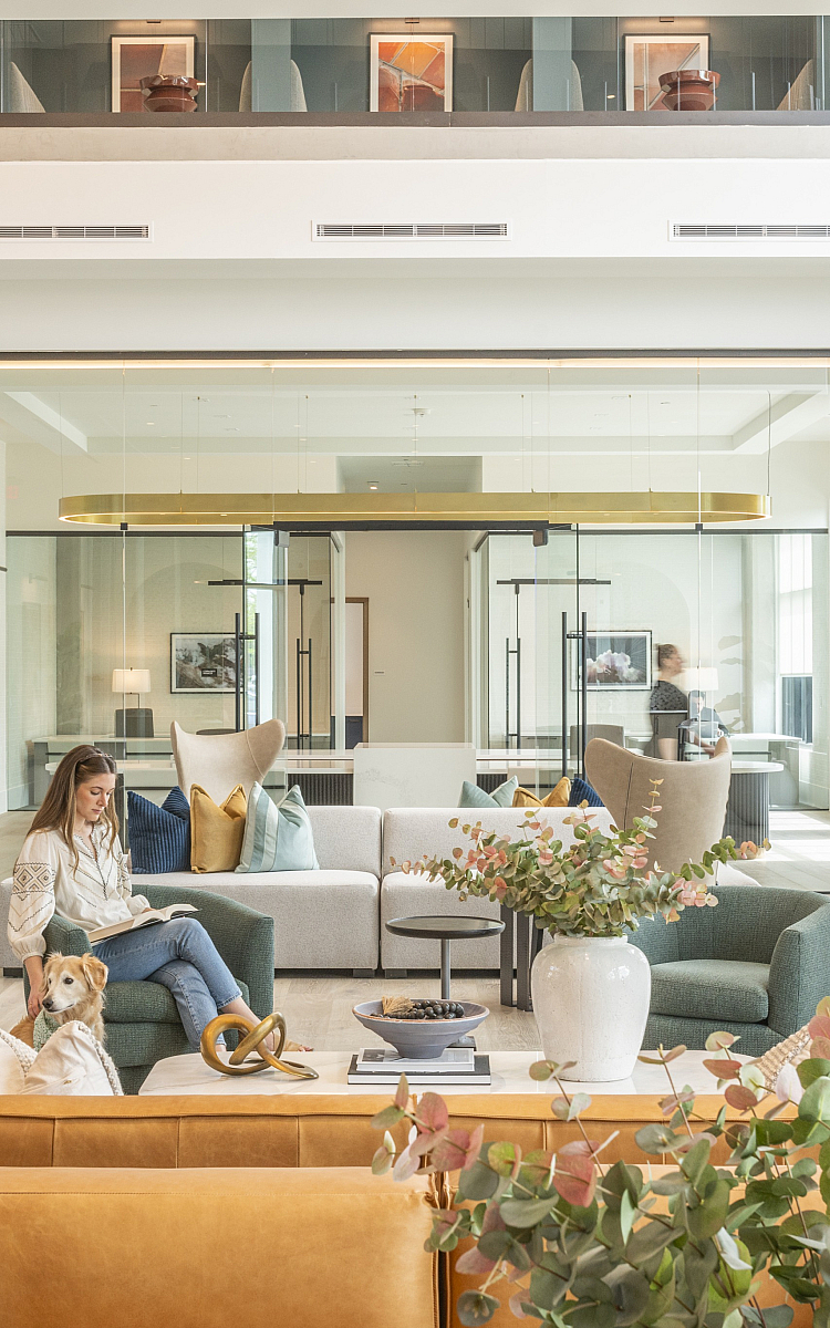 Chic and inviting lobby lounge featuring modern seating, lush greenery, and an ambiance perfect for relaxation.