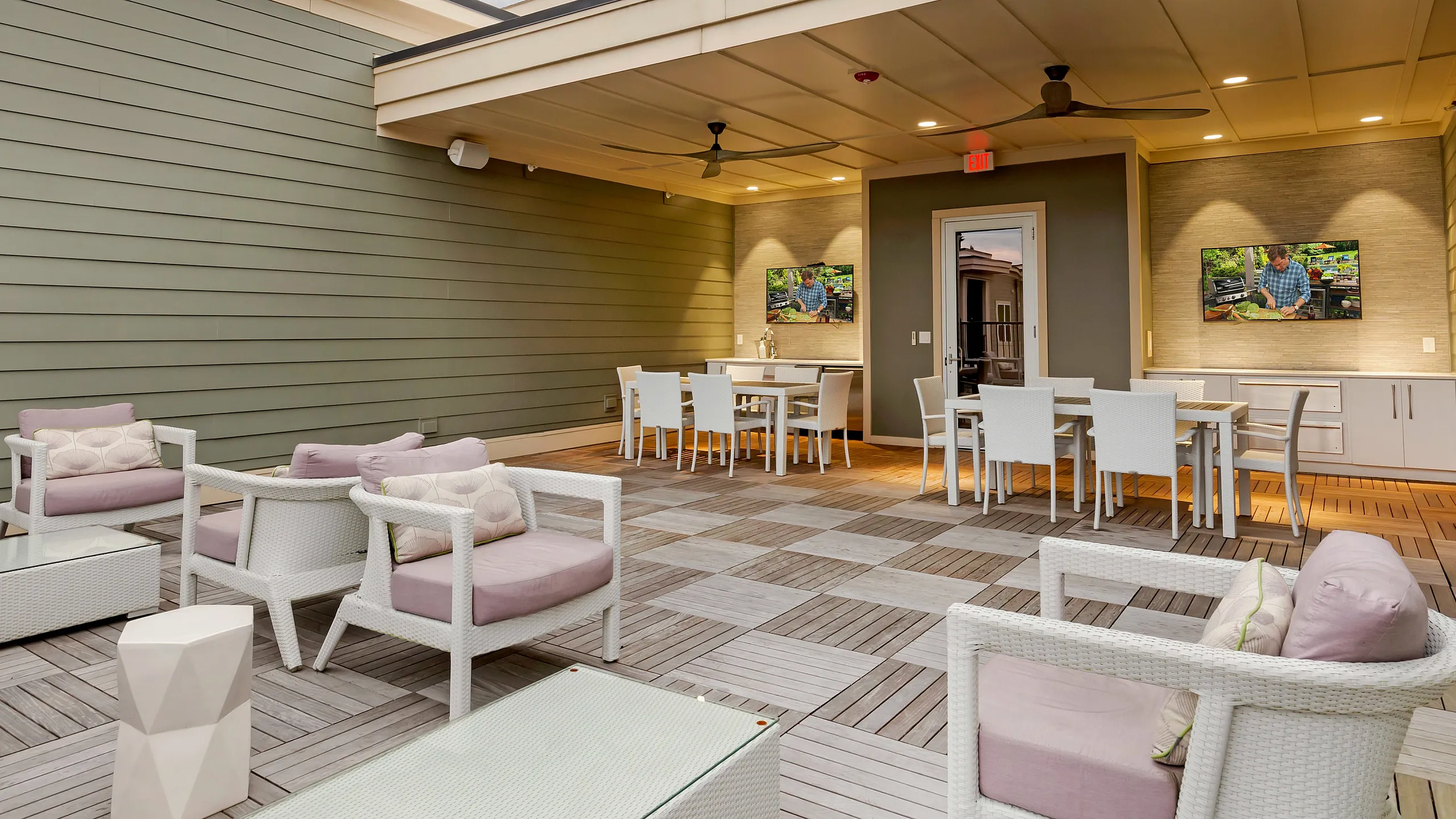 Elegant outdoor patio with cozy seating and stylish dining area under a modern pergola, perfect for relaxation and entertainment.