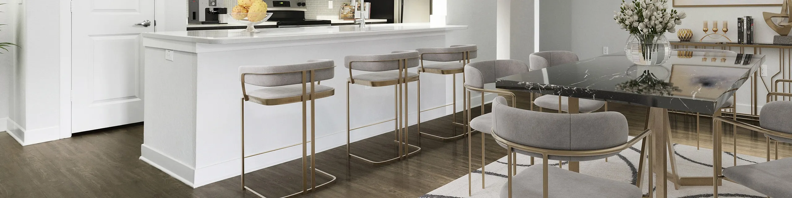 Modern open-concept living room and kitchen with elegant decor, stylish bar seating, and sophisticated lighting. Perfect for entertaining.
