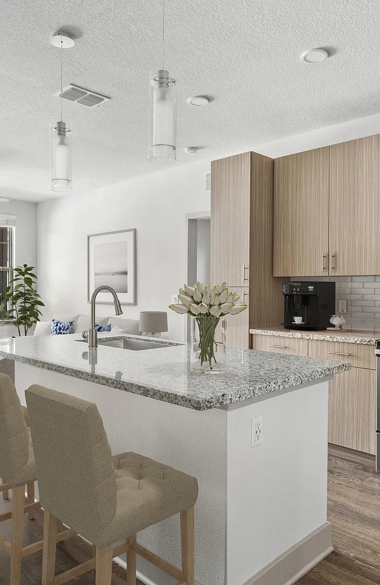 Bright, modern kitchen with granite countertops, stainless steel appliances, and cozy seating area leading to sunlit balcony access.