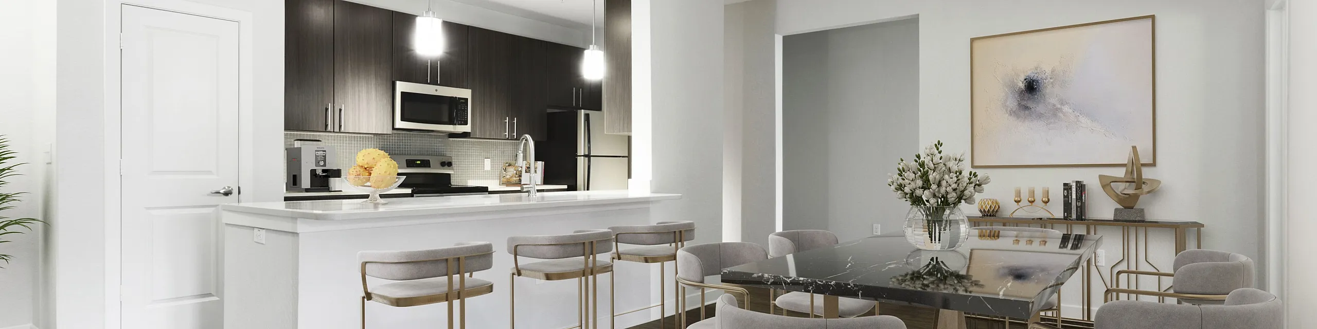 Elegant open-concept living and dining area with sleek modern kitchen, sophisticated dark cabinetry, and stylish bar seating.