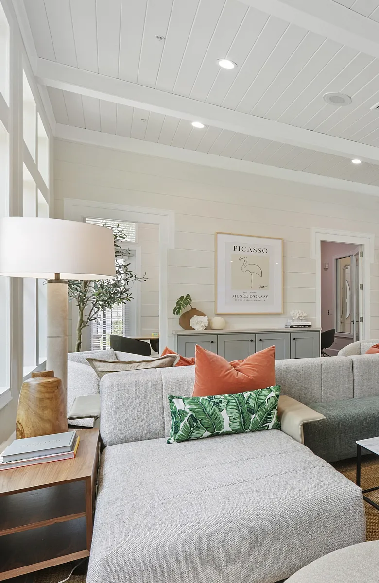 Chic and spacious open-concept lounge with stylish seating, large windows, and modern decor, perfect for relaxation or entertaining.