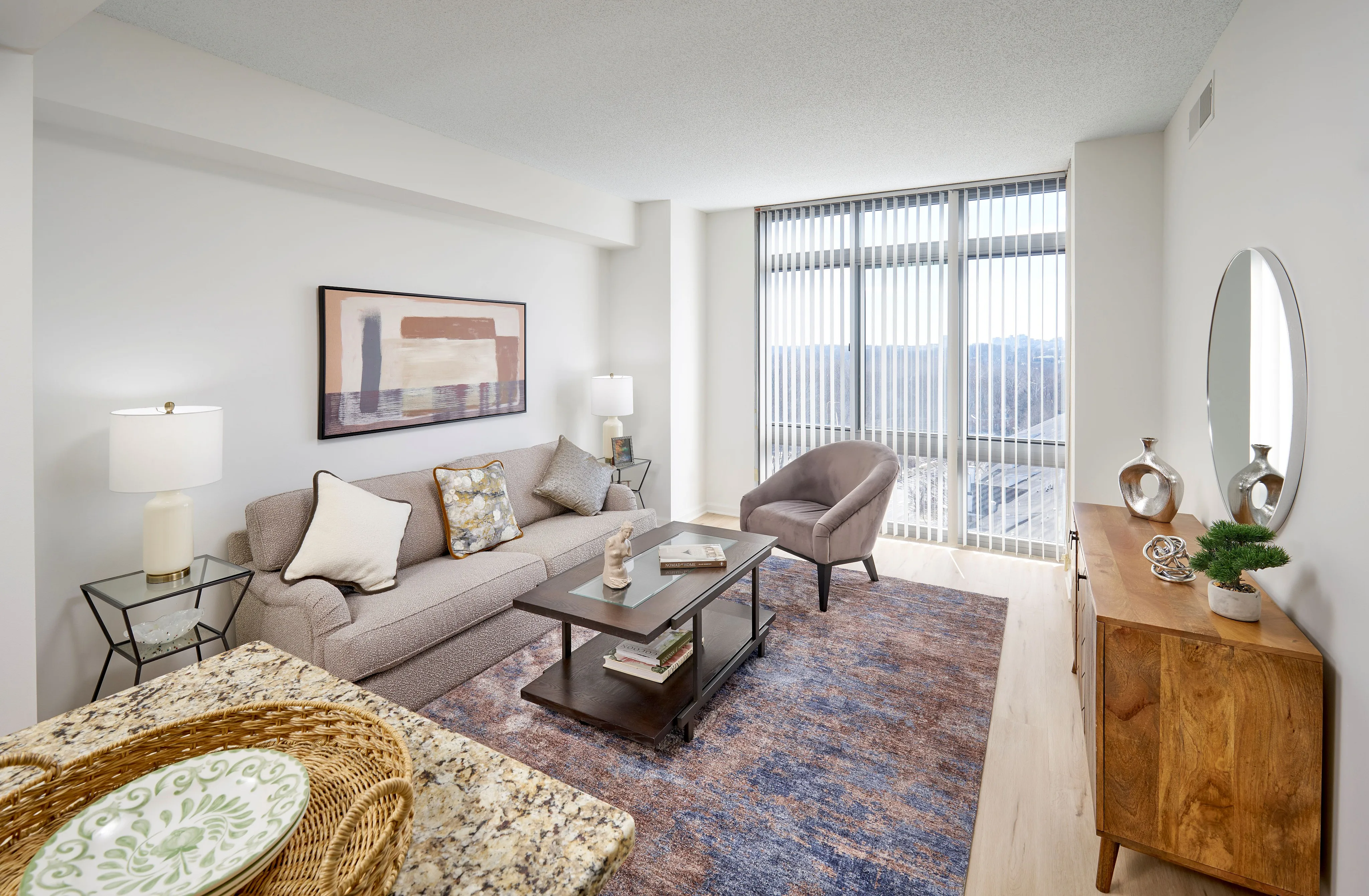 Renovated Ellington One Bedroom living room with wood-style vinyl flooring and modern lighting | Meridian at Grosvenor Station | Luxury North Bethesda MD Apartments | Luxury Rockville MD Apartments