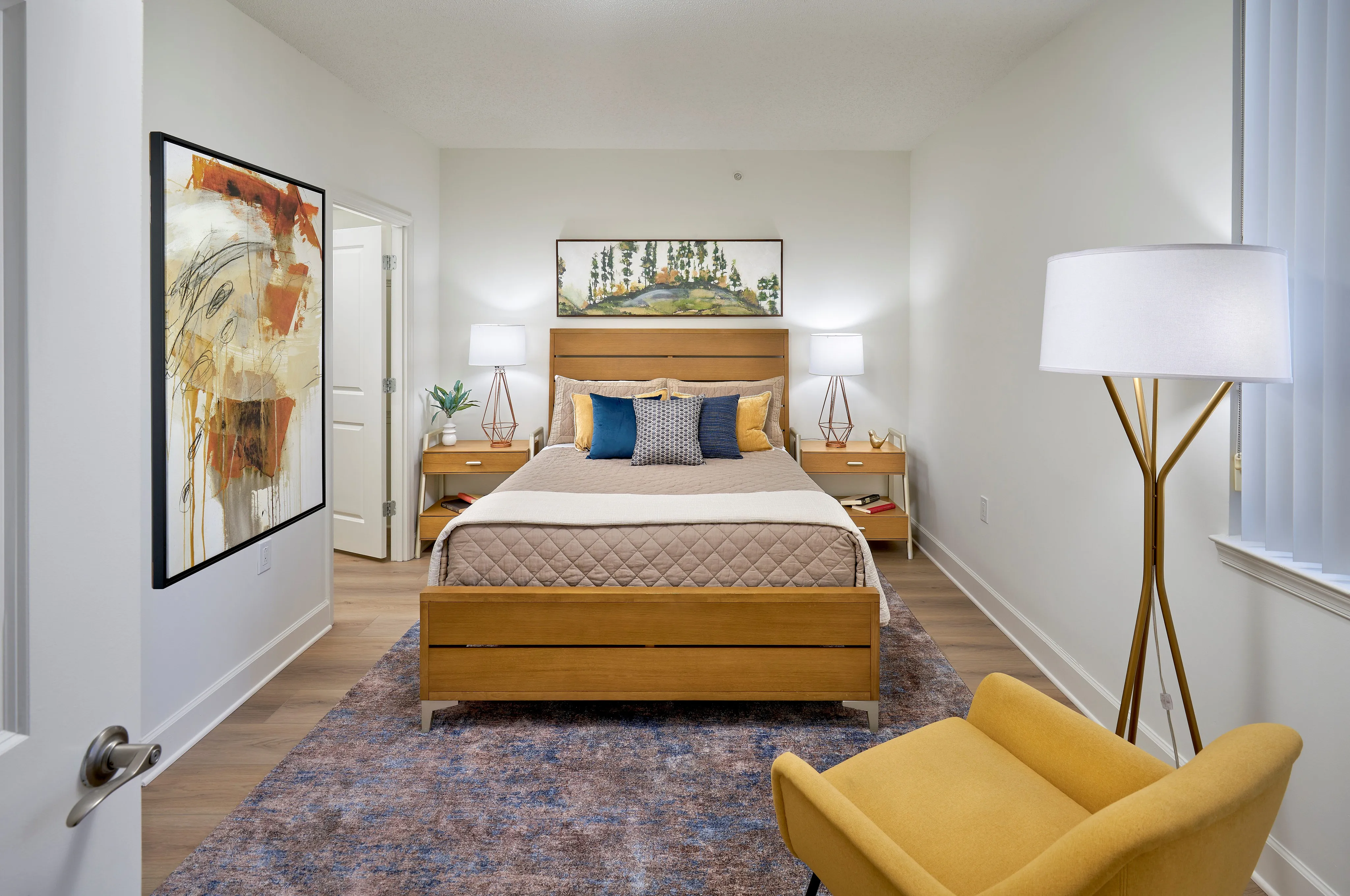 Renovated Newport 1BR bedroom at Meridian at Eisenhower with wood-style flooring. | Meridian at Eisenhower Station | Luxury Alexandria VA Apartments