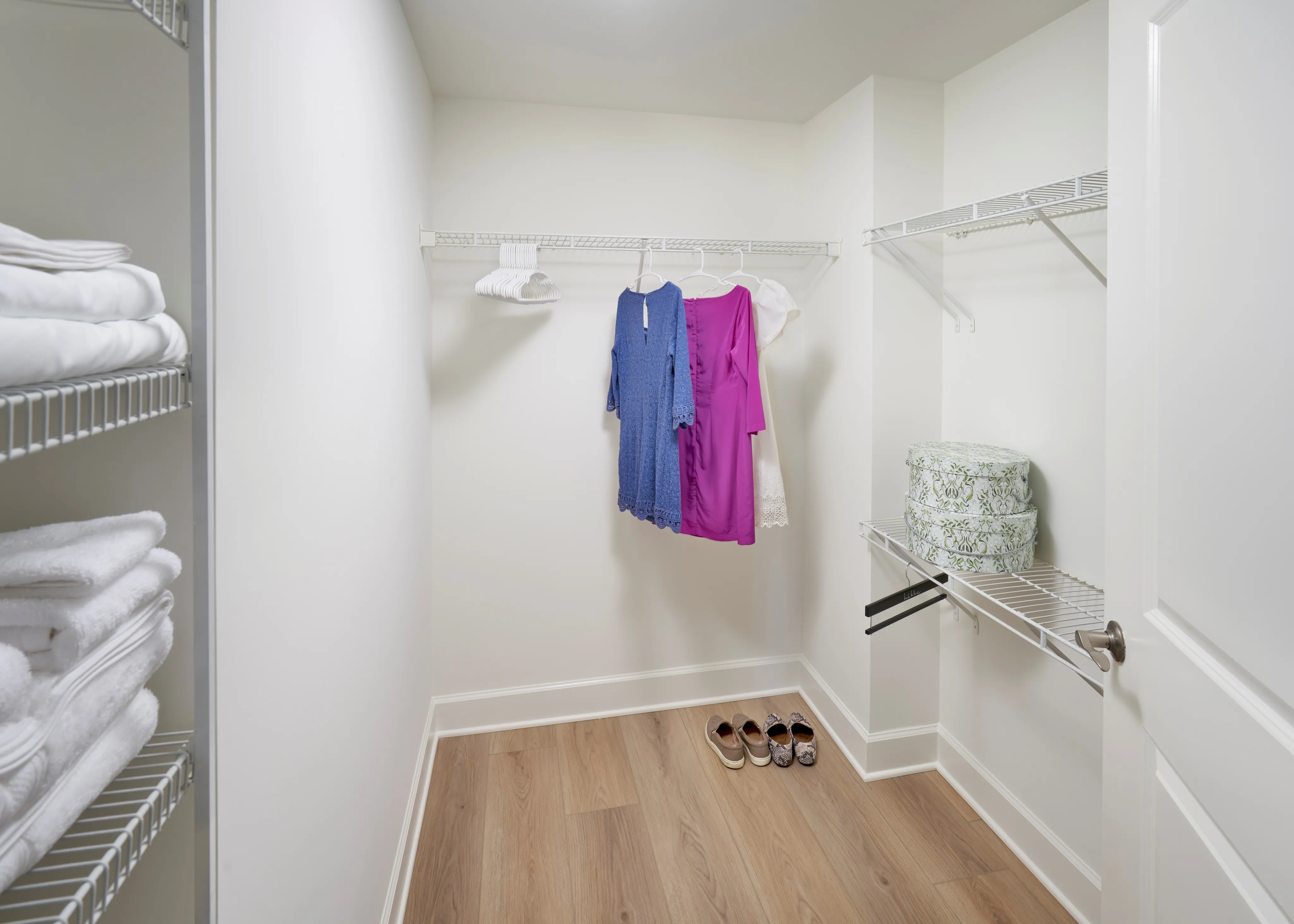Walk-in closet in renovated Newport 1BR at Meridian at Eisenhower with ample storage and wood-style flooring. | Luxury Alexandria VA Apartments