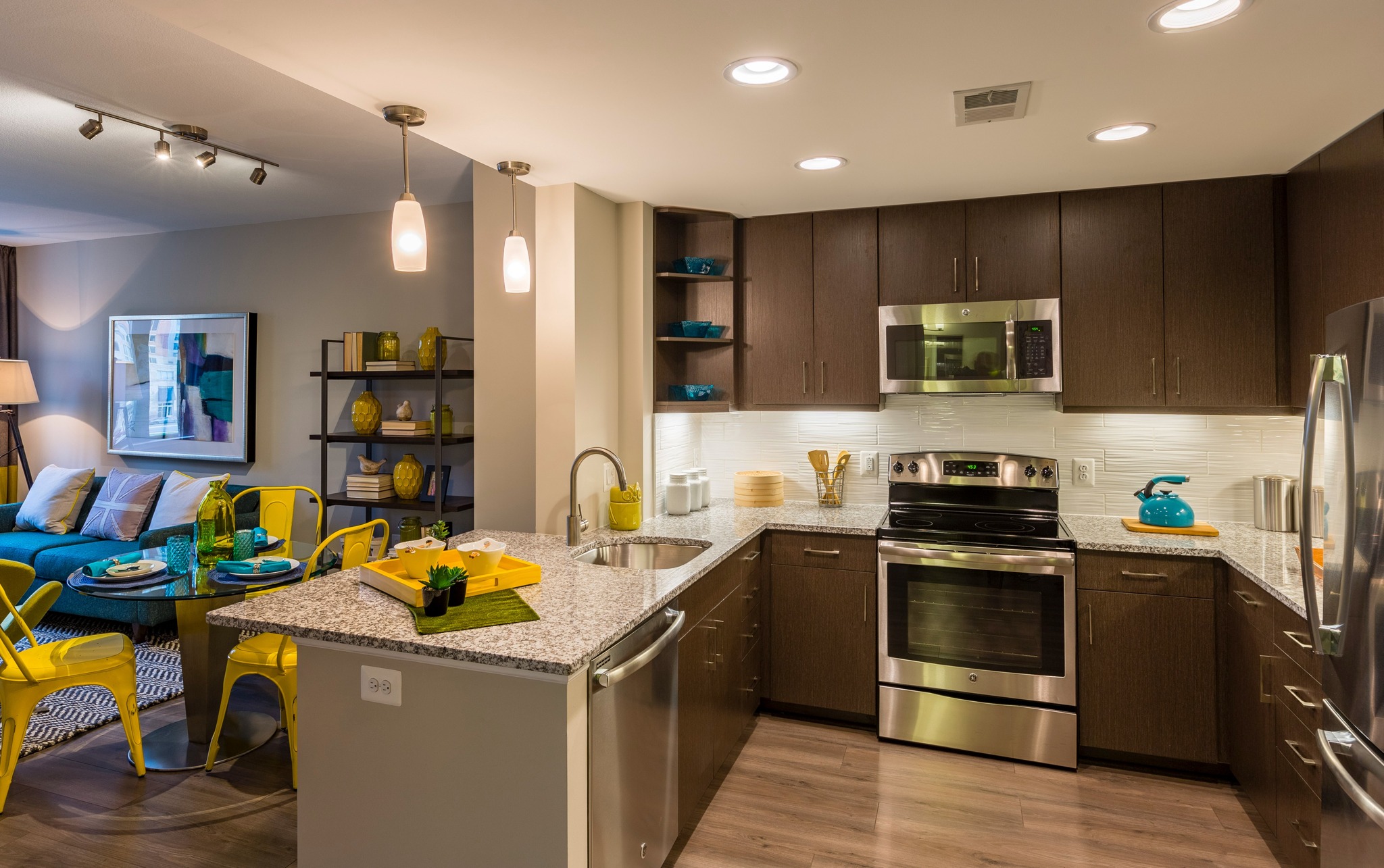Image of An Open Kitchen with Granite Countertops, Wood-Style Flooring & Stainless Steel Appliances | Parc Meridian at Eisenhower Station | Luxury Alexandria VA Apartments