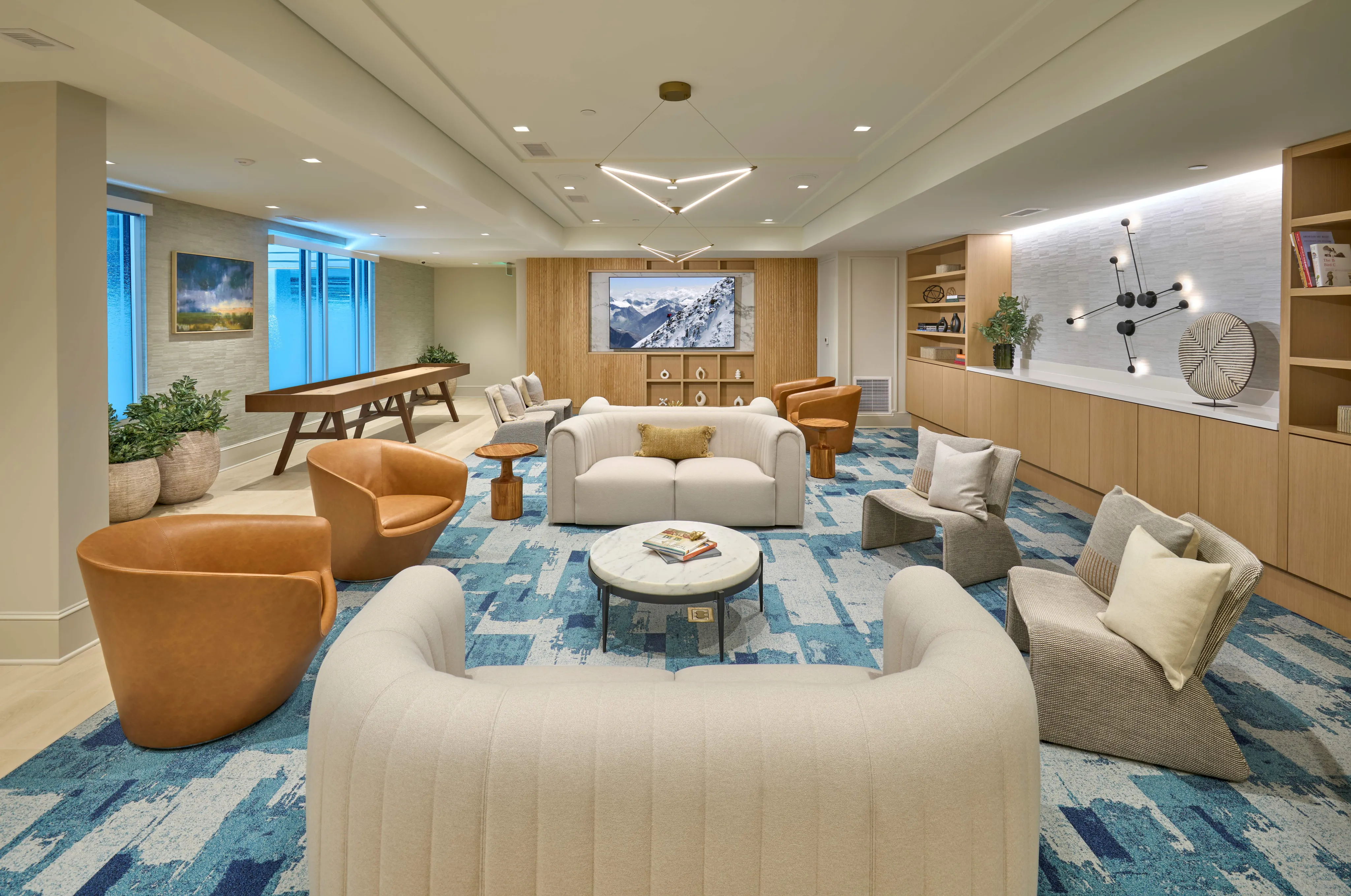 Indigo at McLean Station Phase I Club Room With Shuffleboard, TV, Kitchen & More | Affordable Tysons Corner Apartments | Affordable McLean VA Apartments | Affordable Fairfax VA Apartments