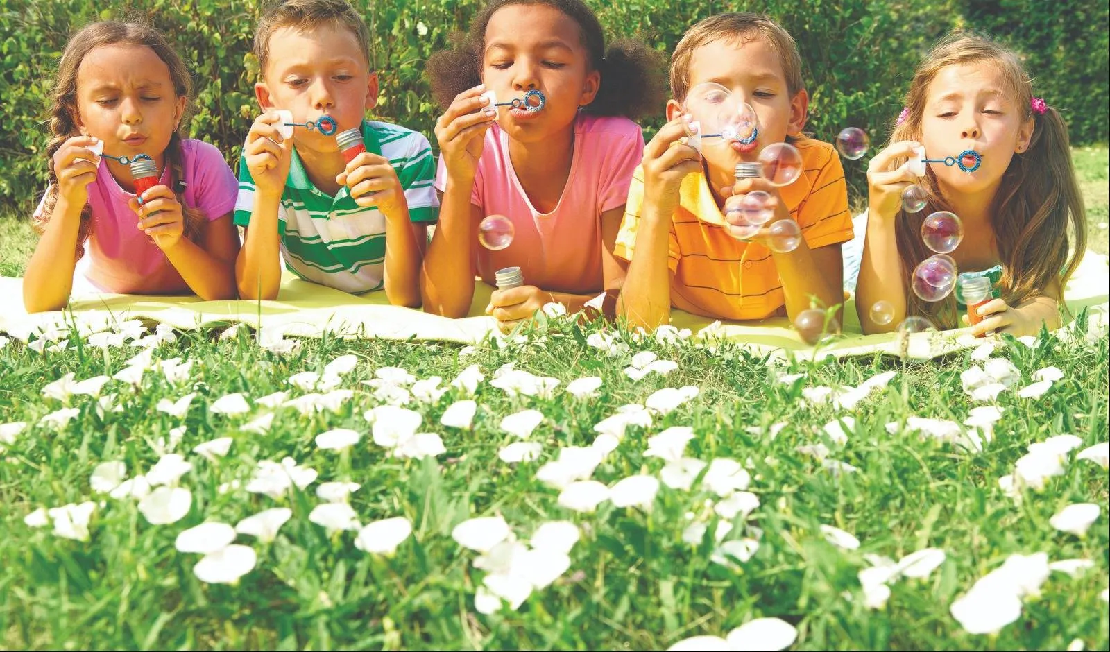 Photo of Children Blowing Bubbles | Residences at Government Center | Affordable Fairfax Apartments