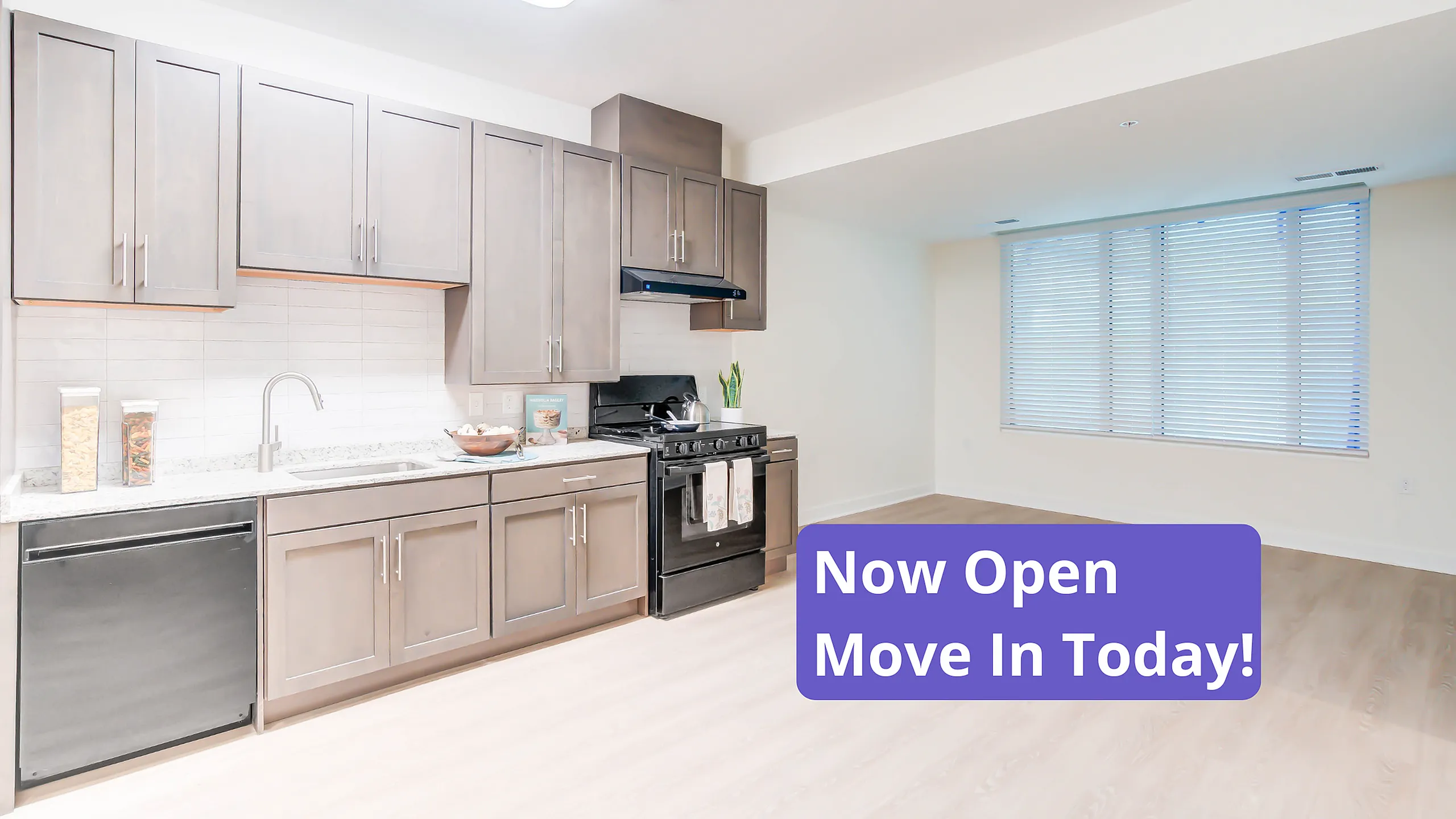 Photo of a Kitchen With a Banner Saying Now Open- Move In Today! | Indigo at McLean Station | Affordable Tysons Corner Apartments | Affordable Fairfax Apartments | Affordable McLean Aparments