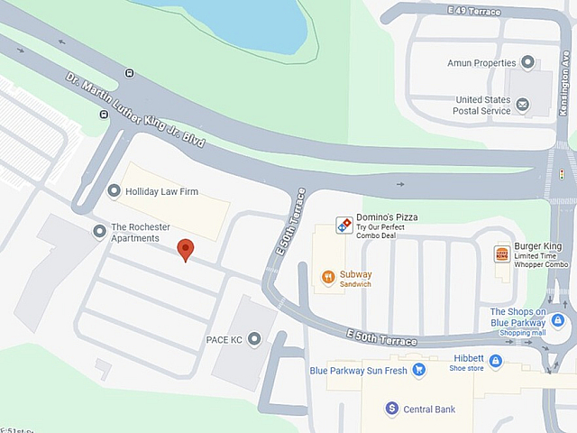 Map view highlighting The Rochester Apartments near Swope Park with nearby dining options like Domino's Pizza and Subway, and amenities including shops and a law firm.