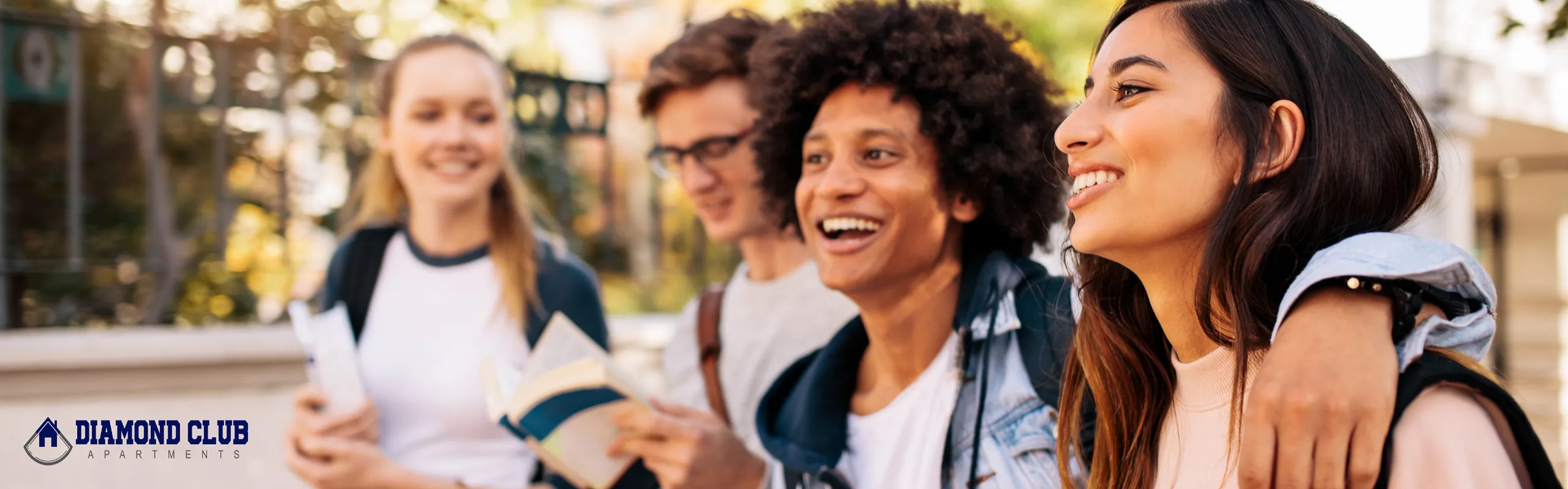 group of college student walking through campus