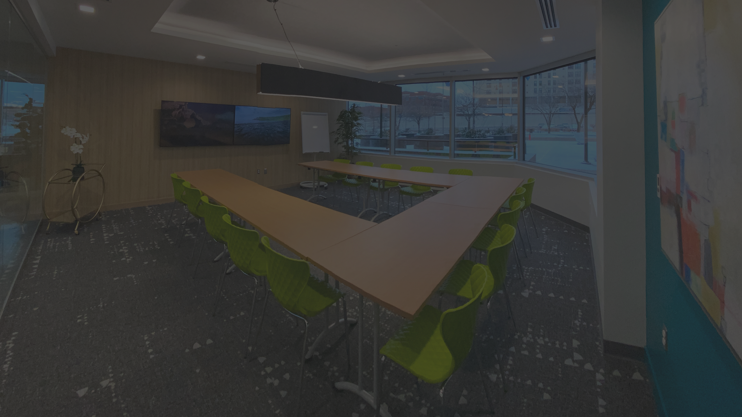 conference room with tvs looking onto downtown kc street
