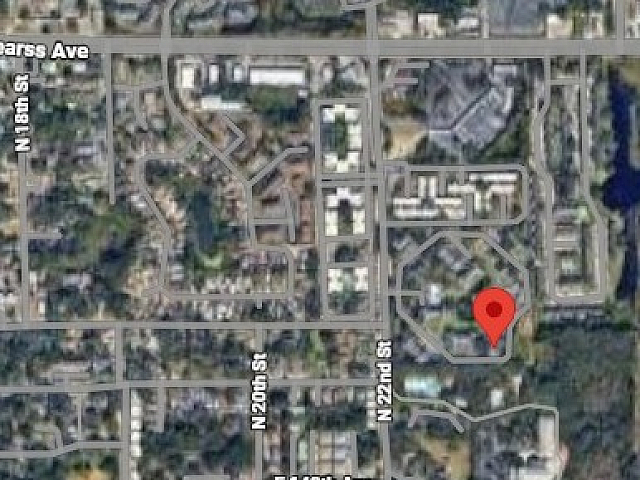 Dynamic aerial view showing a prime urban location with easy access to main streets and vibrant neighborhood amenities.