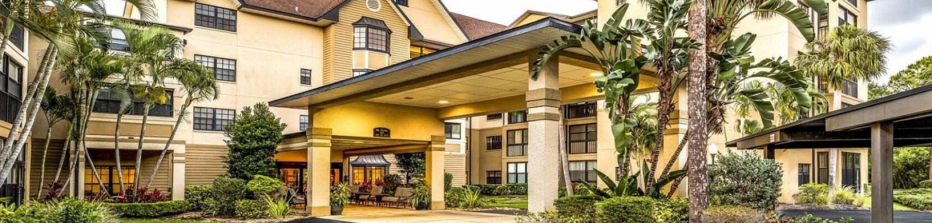 Charming residential complex with lush landscaping and welcoming entrance.