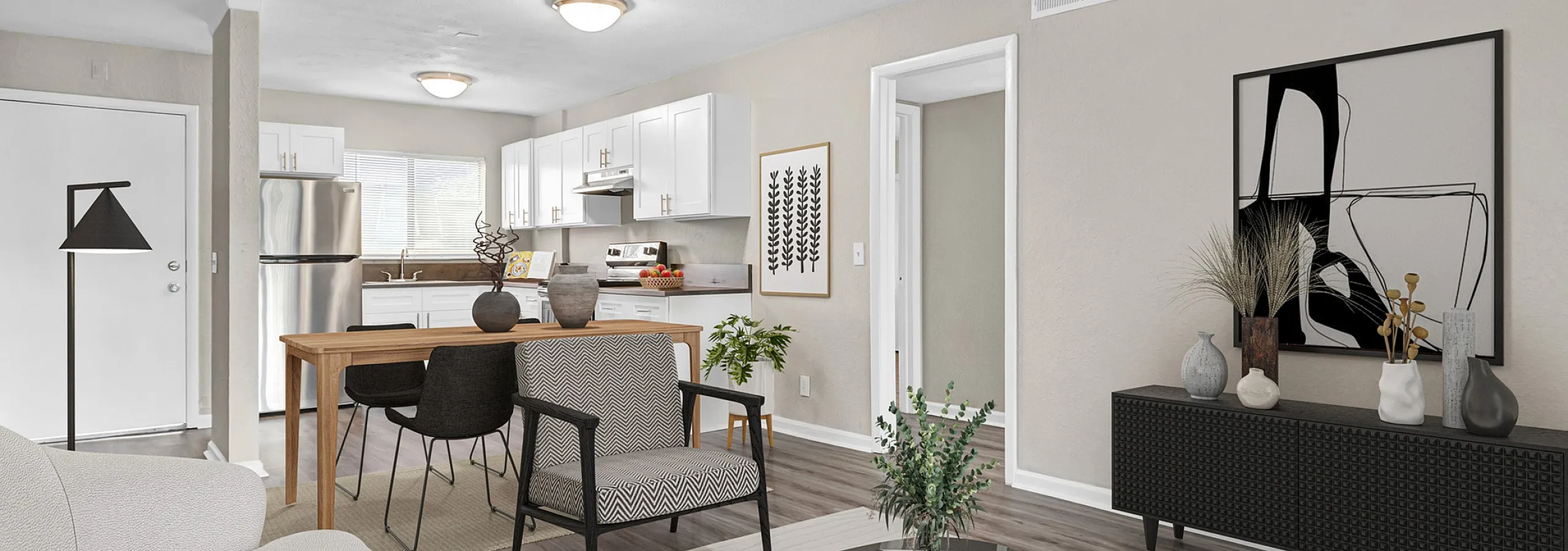 Modern open-plan living space with stylish furnishings, sleek kitchen, and elegant decor.