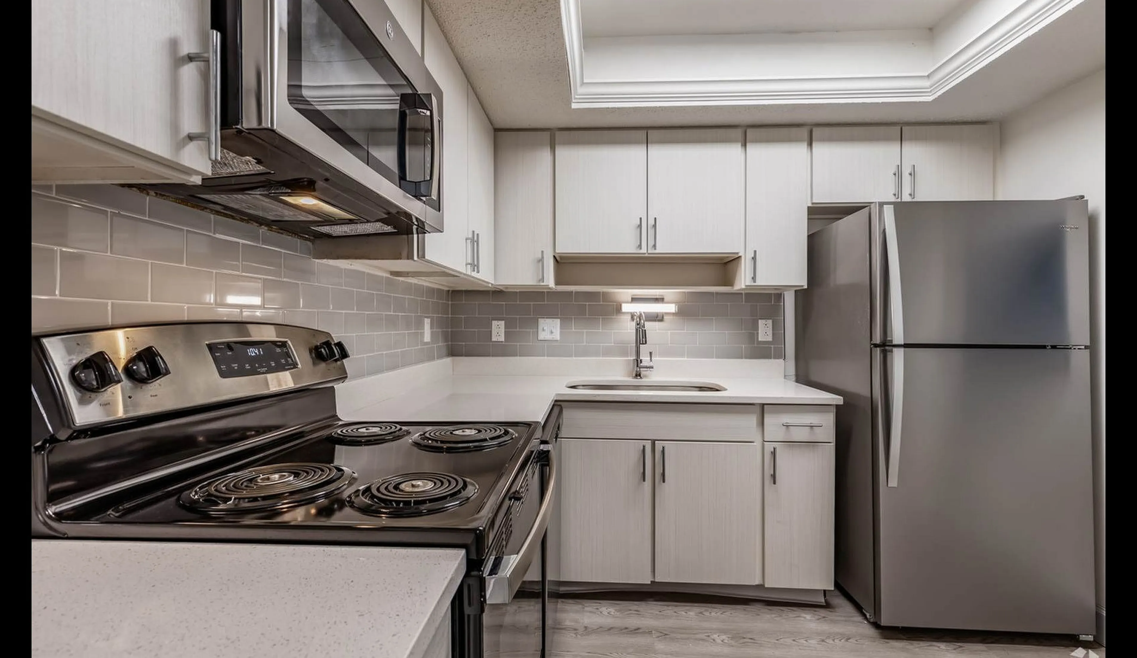 Renovated kitchen with stainless appliances at Nordica Bay