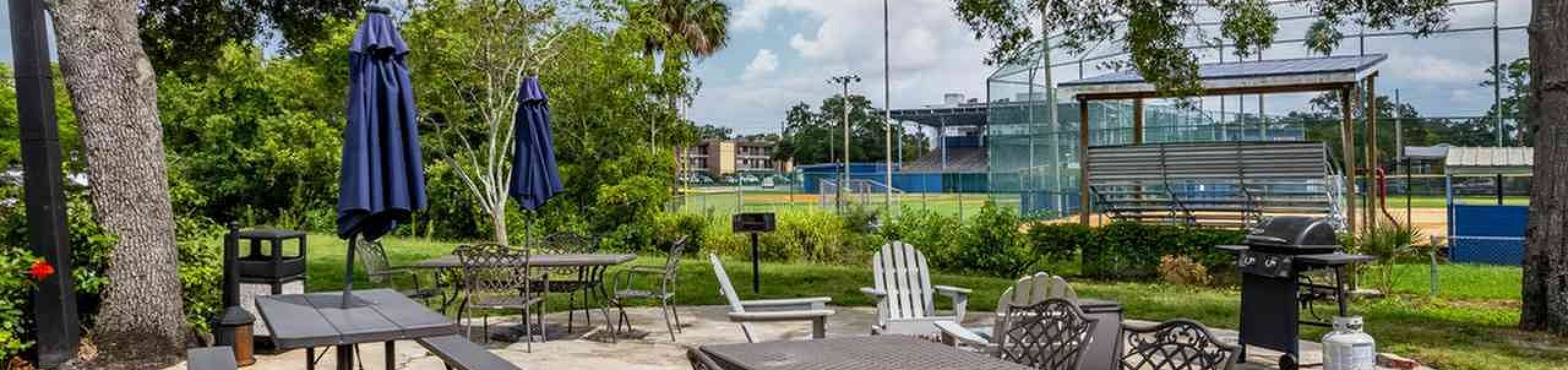 Outdoor grill and patio seating area at Nordica Bay