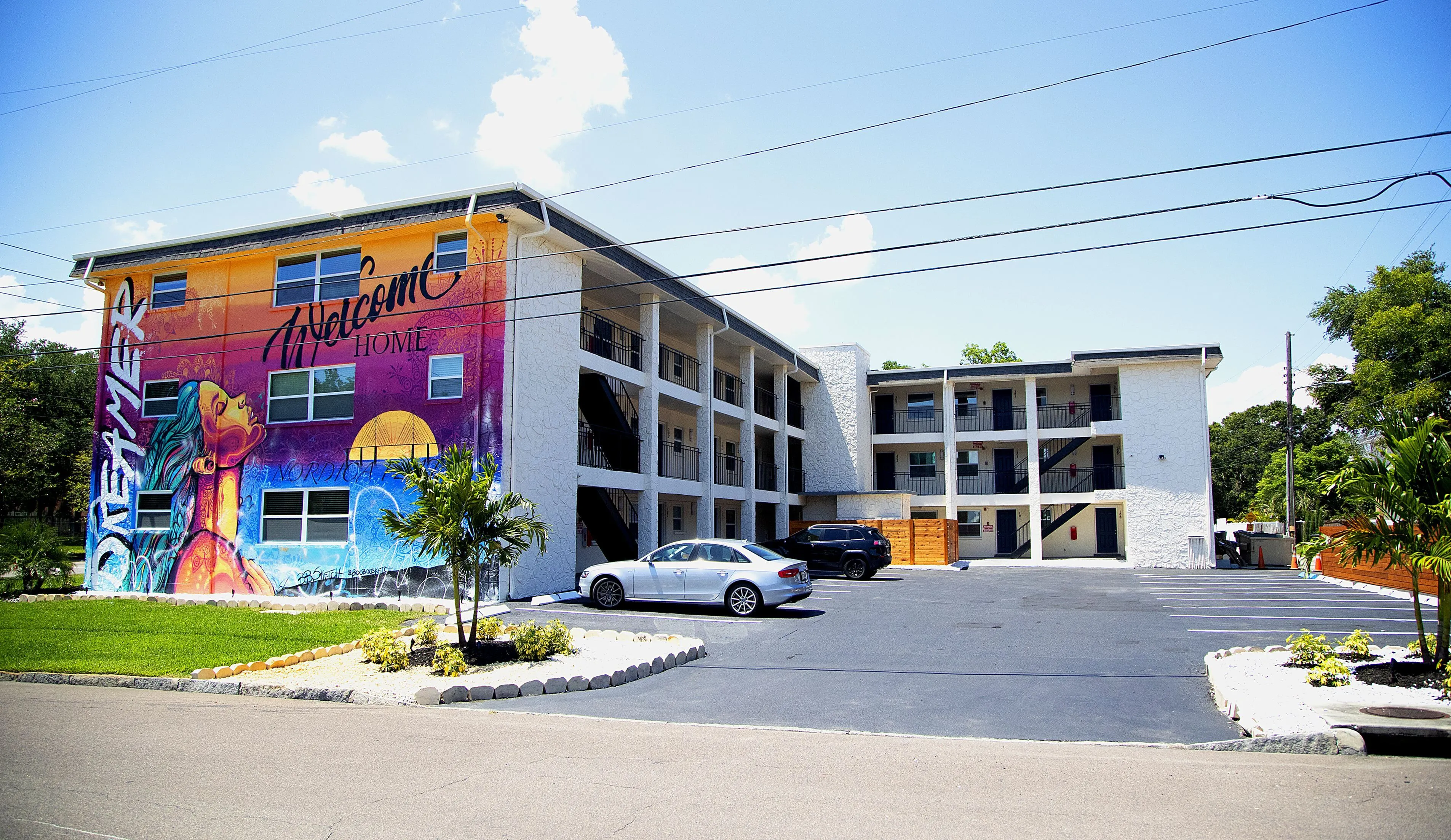 Mural and courtyard at Nordica Flats