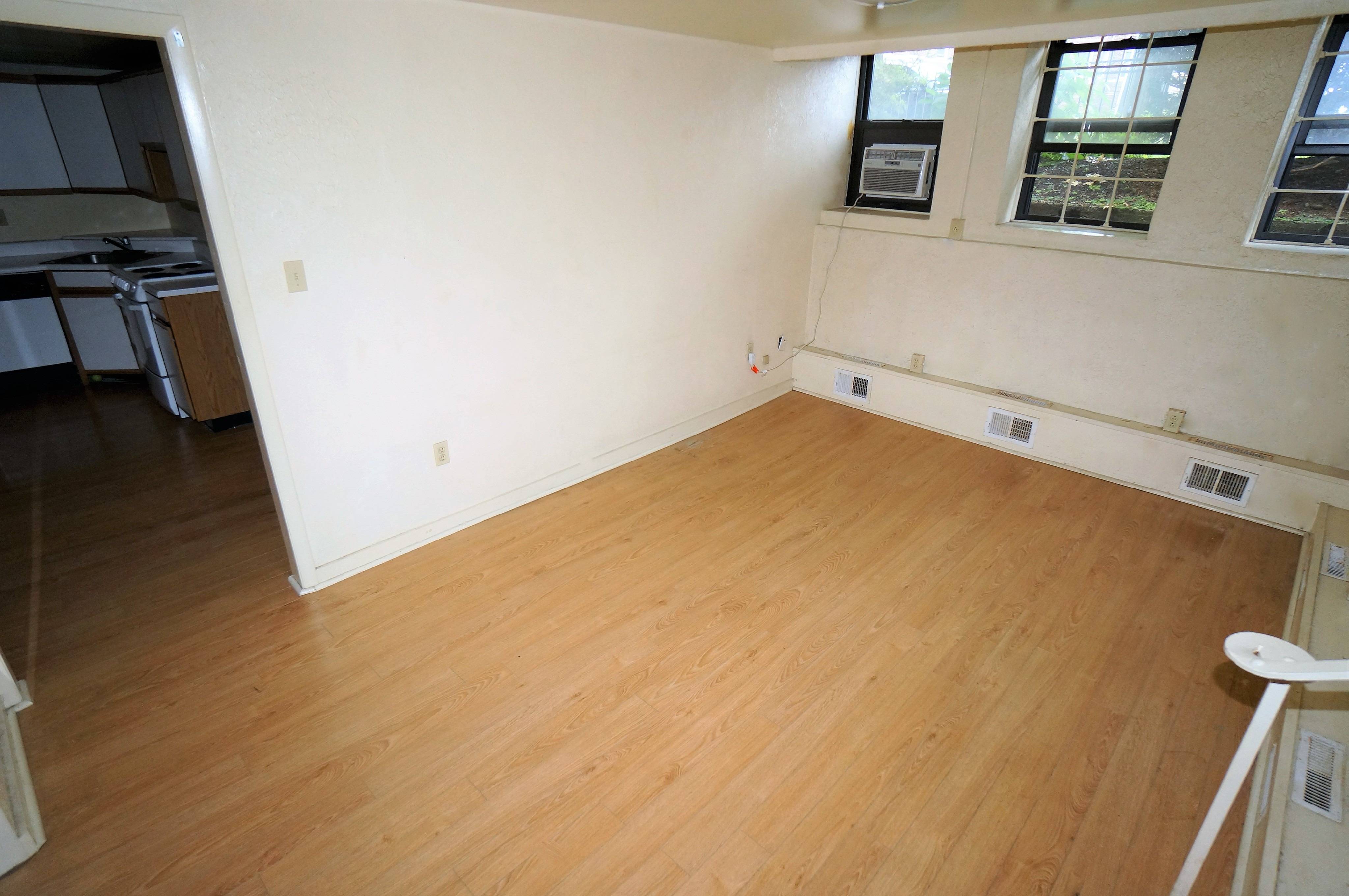 Living Room shows windows and doorway to kitchen