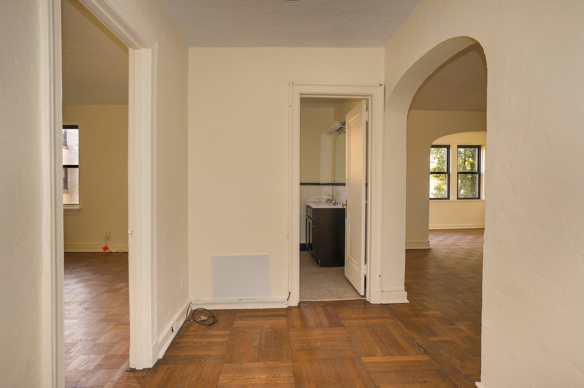 Foyer shoes bedroom door, bathroom door, as well as the doorway to the living room