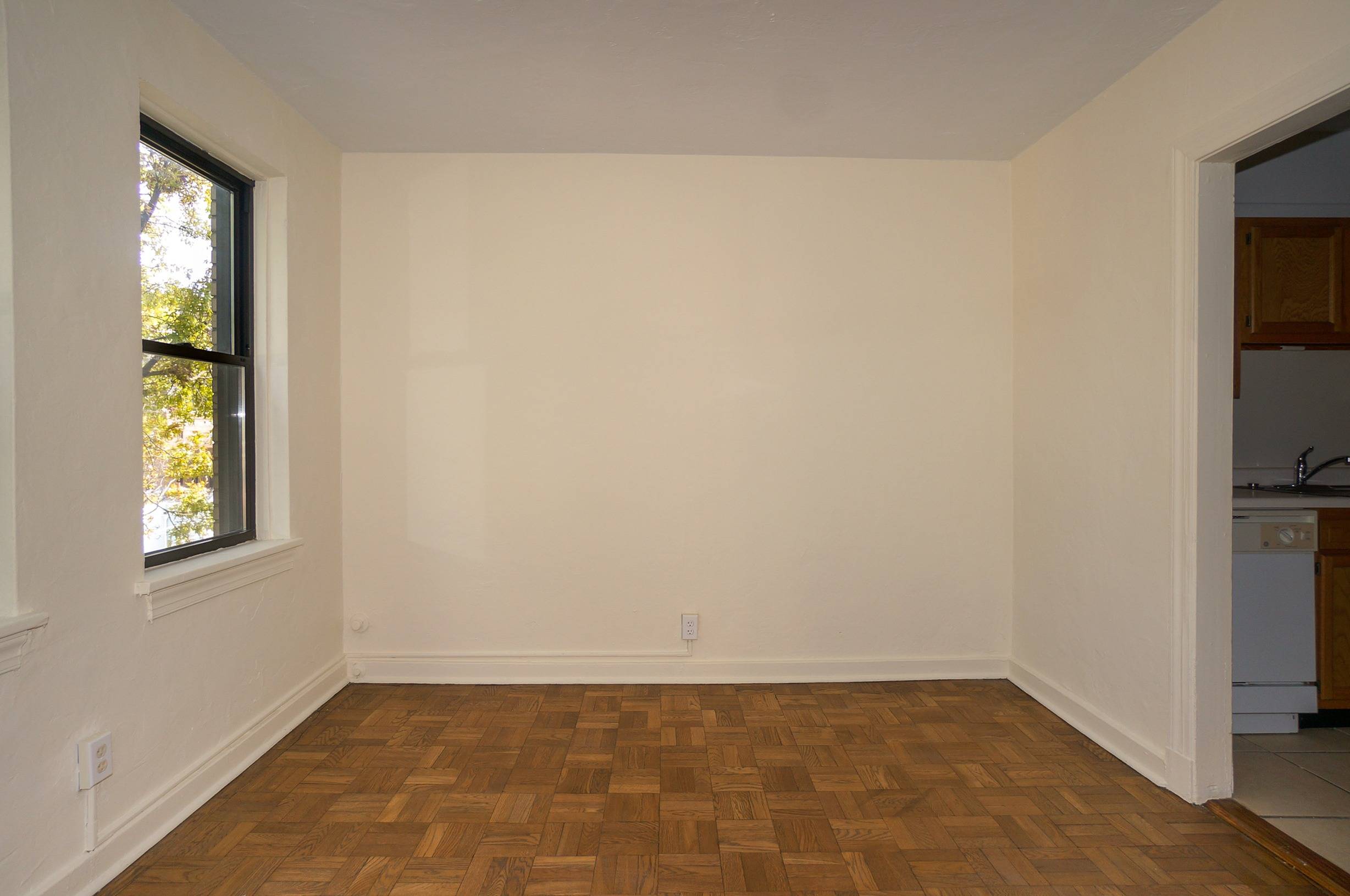 Dining Room shows doorway to kitchen, and windows.