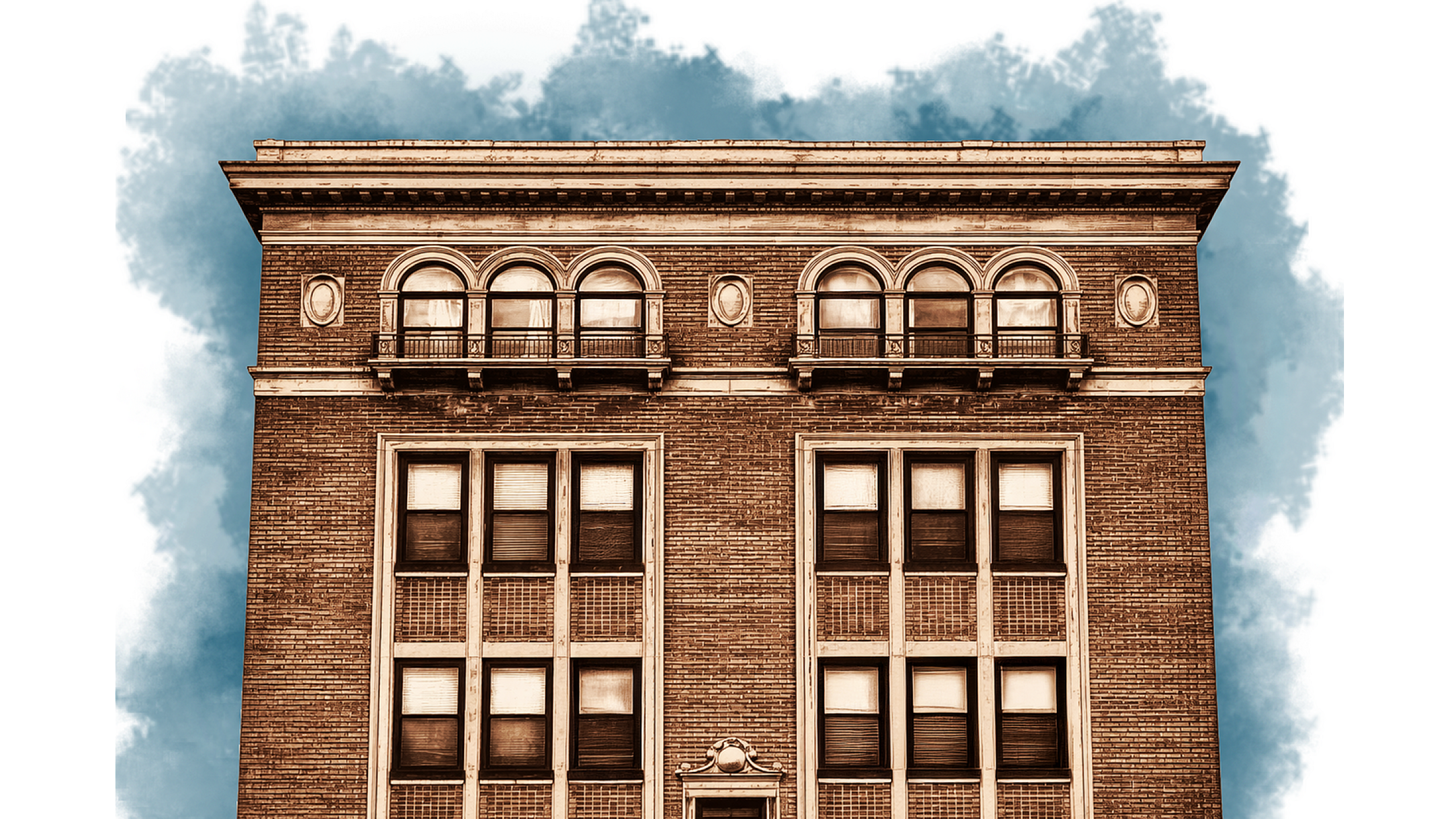 Elegant historic brick building facade with arched windows and classical detailing against a vibrant sky.