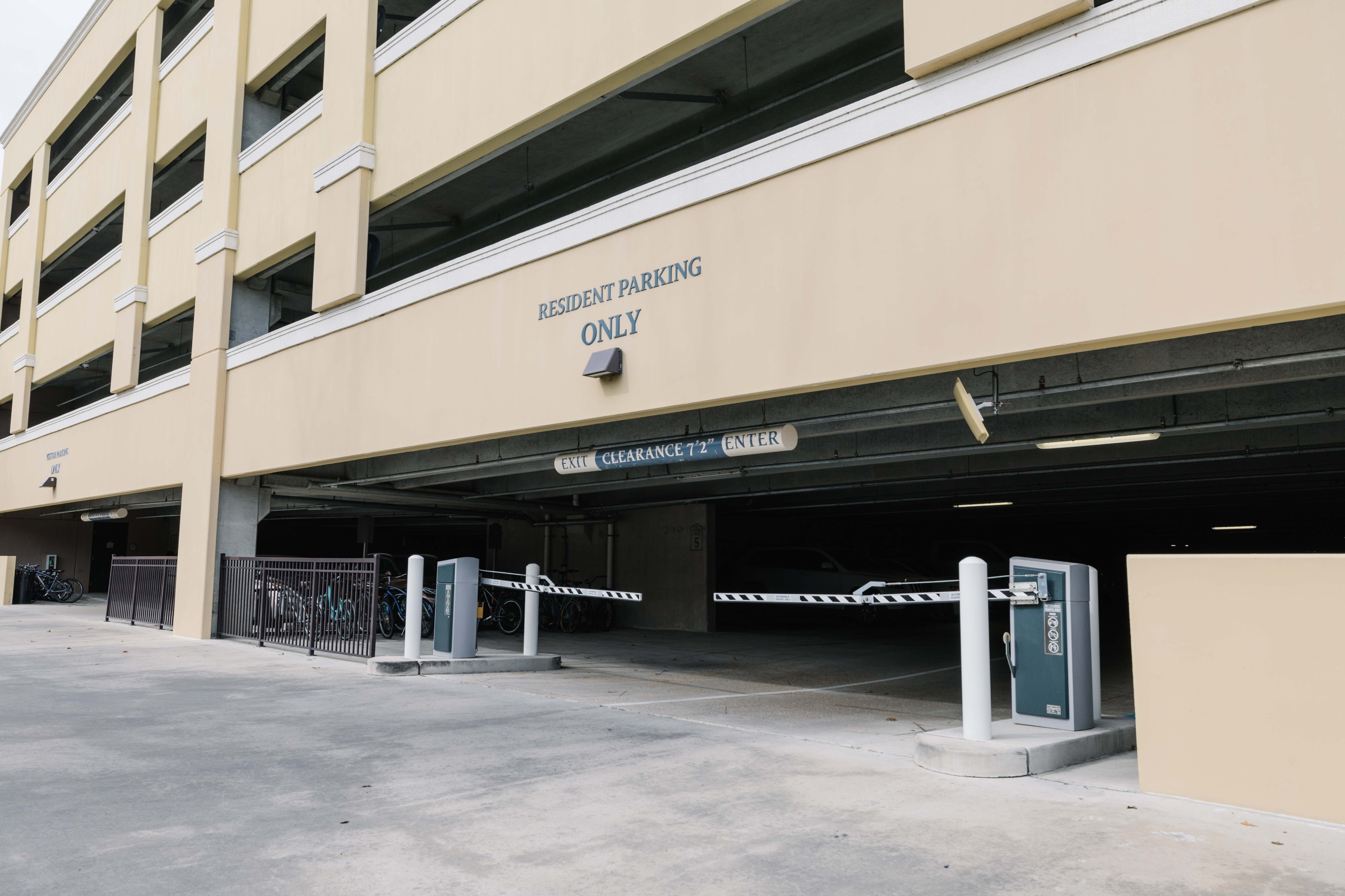 Secure resident parking garage with modern access control and ample space, designed for convenience and safety.