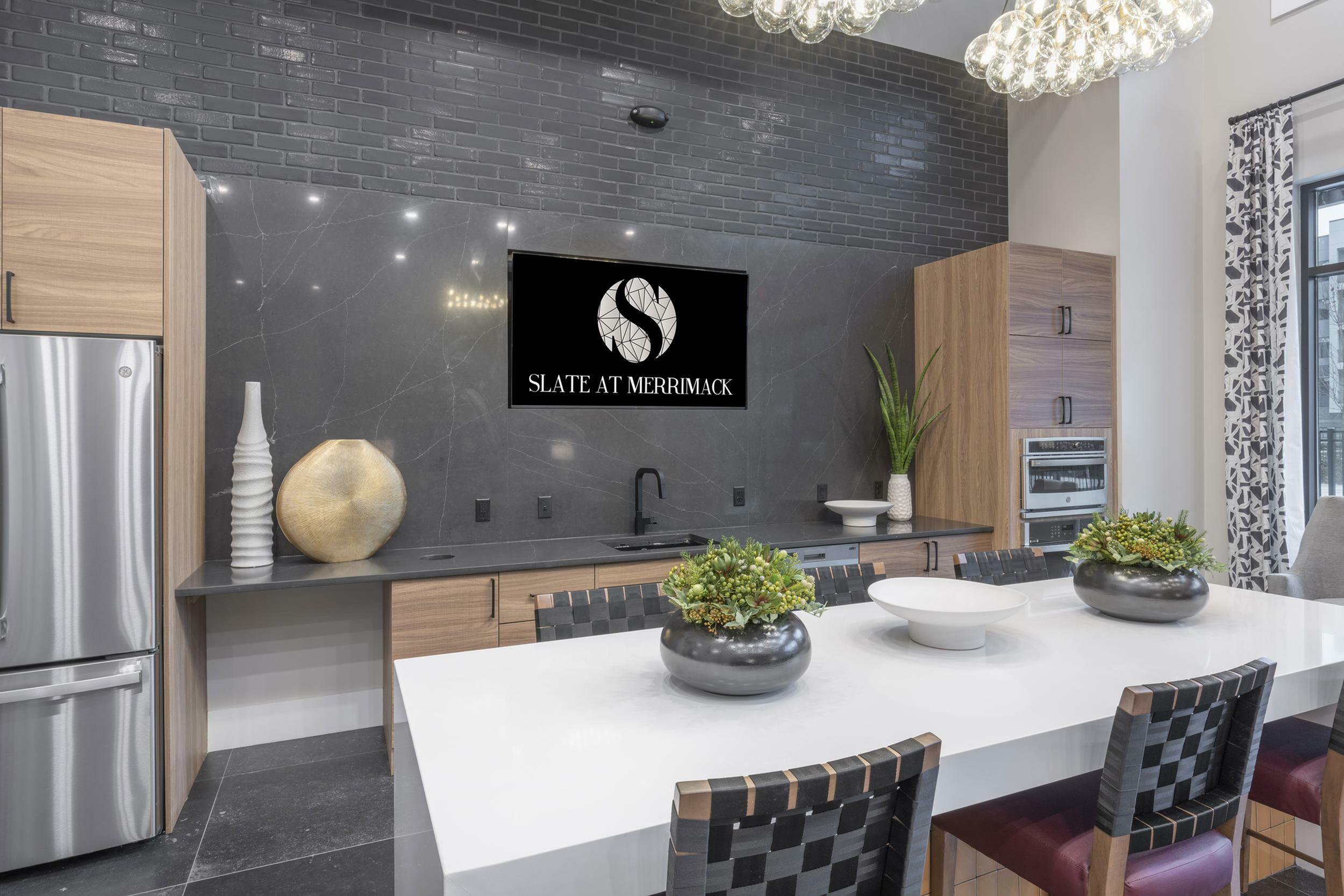 Modern kitchen with sleek countertops, stylish cabinetry, and contemporary decor.