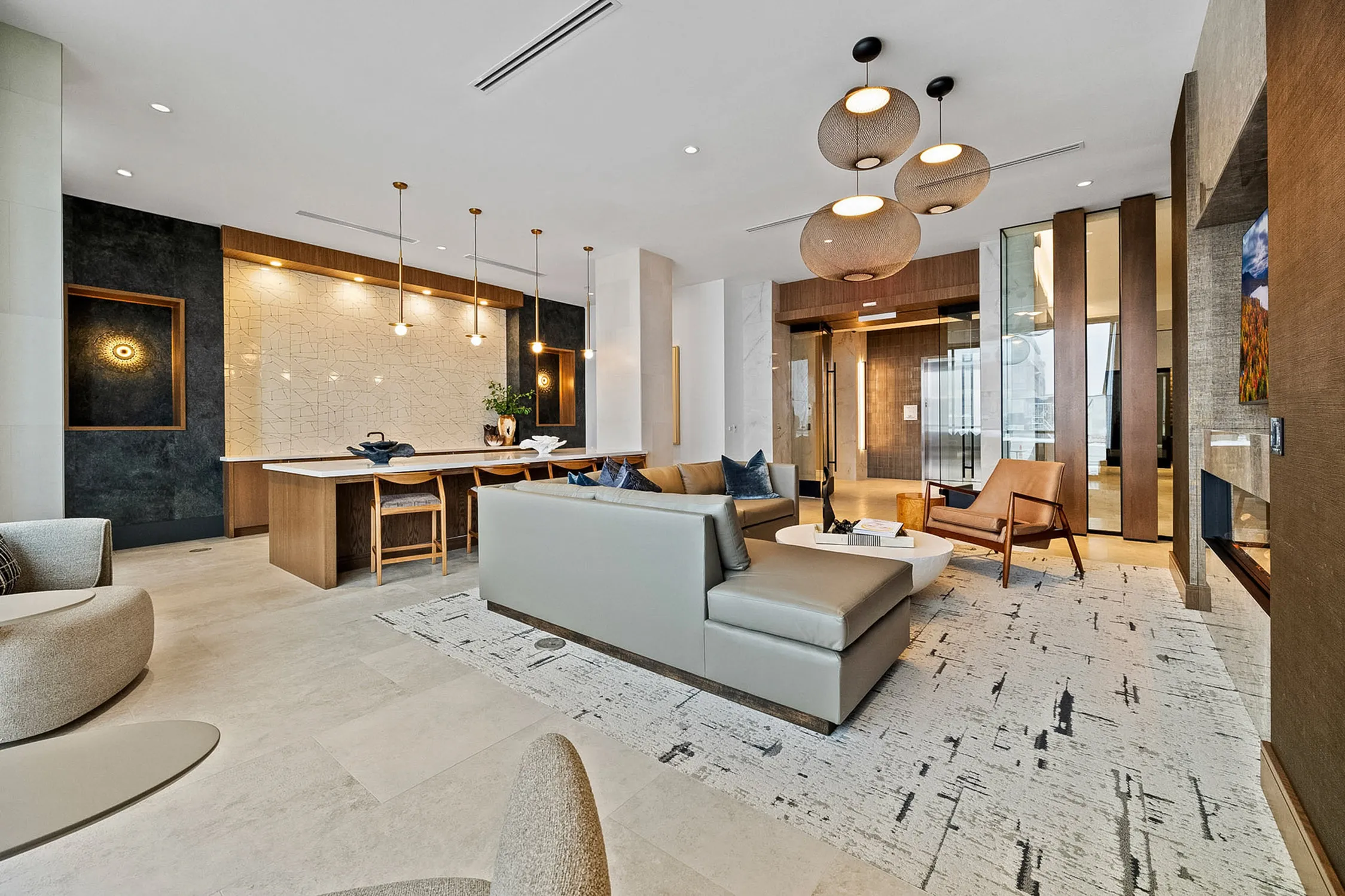 Luxurious open-concept living space with a stylish modern design, featuring a chic kitchen, elegant lounge area, and sophisticated lighting.