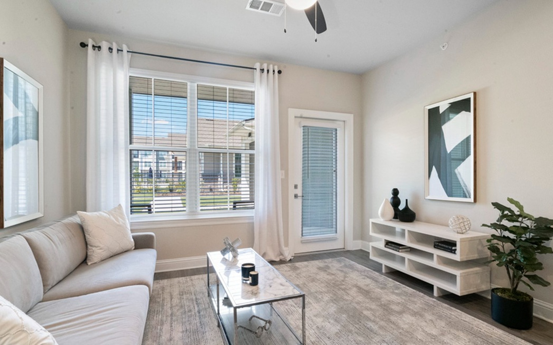 Living with Double Window and Private Patio Access at Sweetwater Apartments in West Baton Rouge, LA