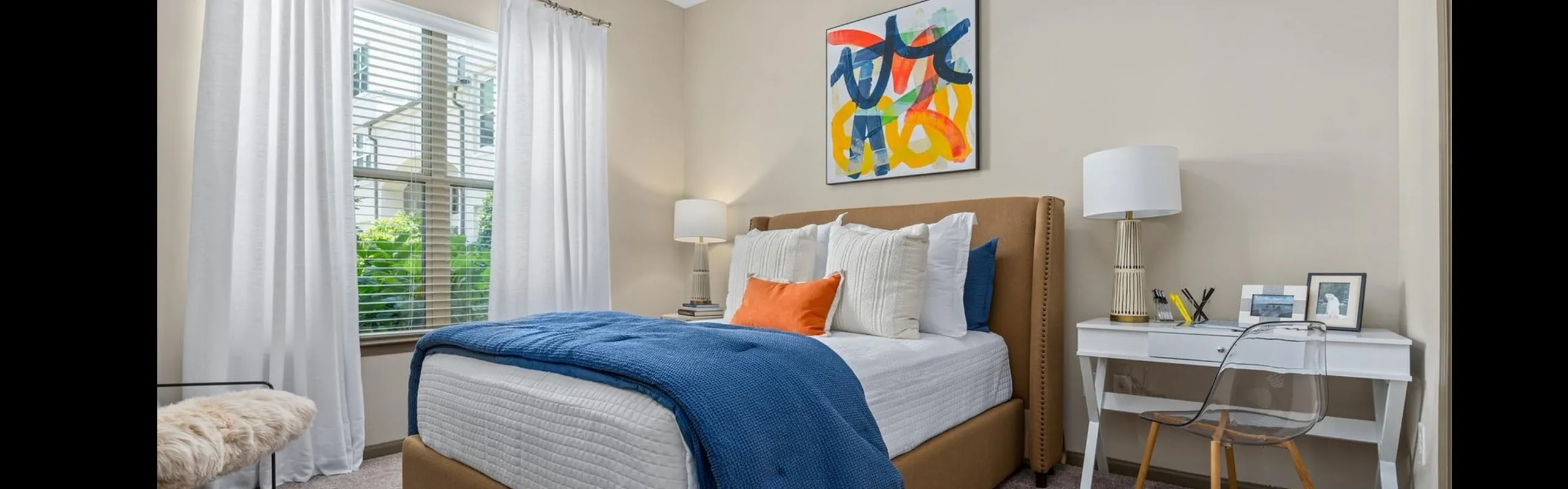 Bedroom with Large Window at RiverHouse Apartments in Little Rock, AR