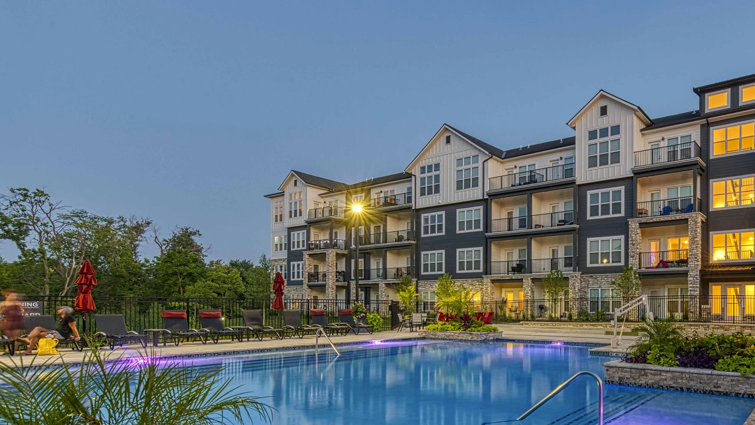 Evening view of pool Encore Apartments Belton MO