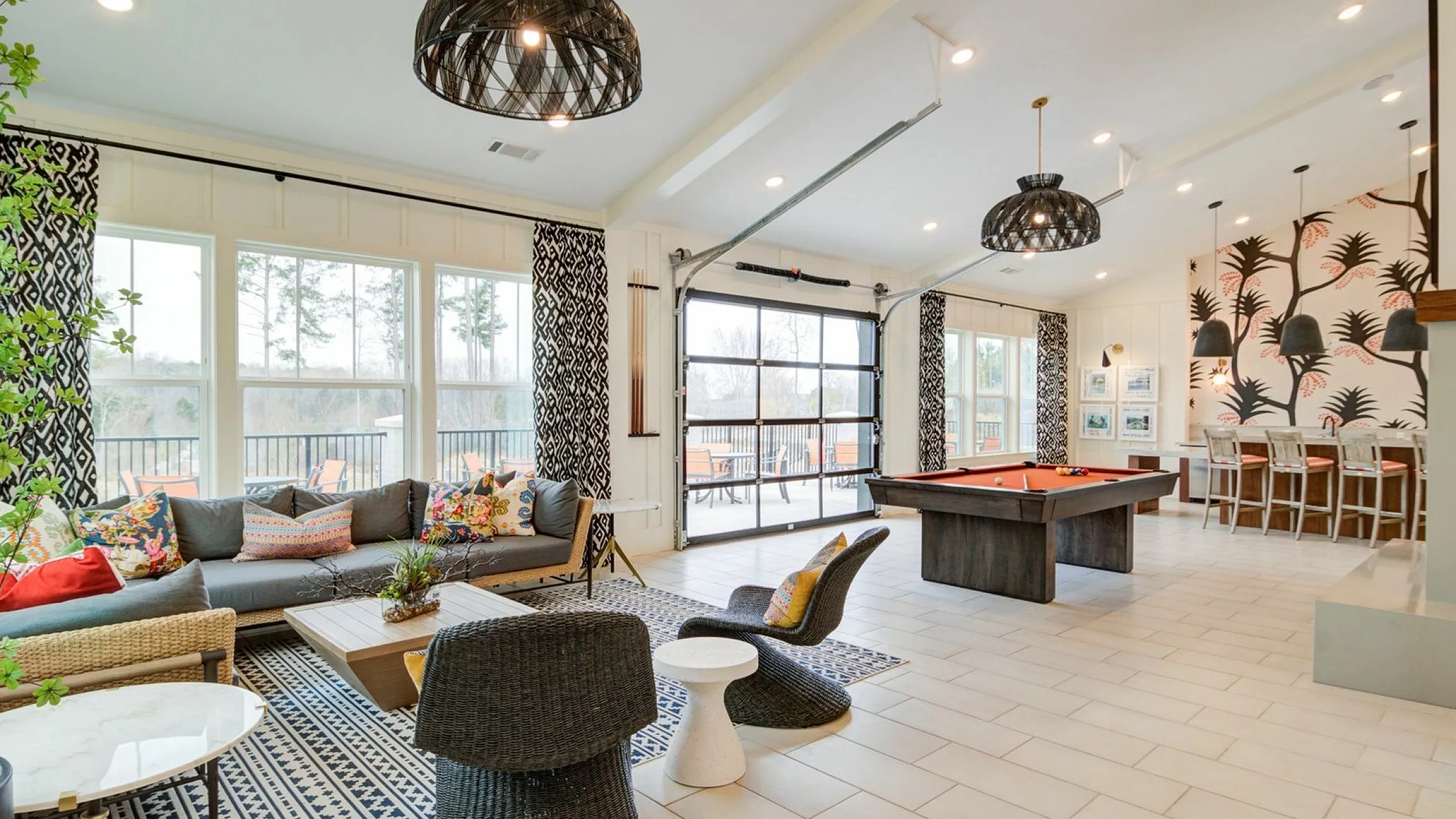 Vibrant open-plan space with stylish seating, pool table, and modern decor.