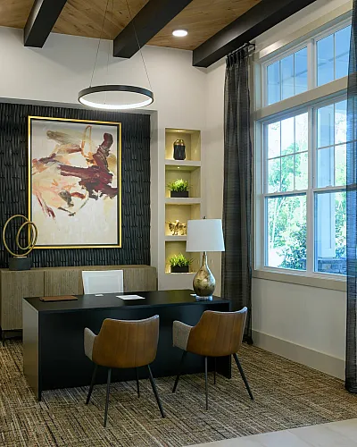 Inviting office area with modern decor, sleek desk, and elegant lighting.
